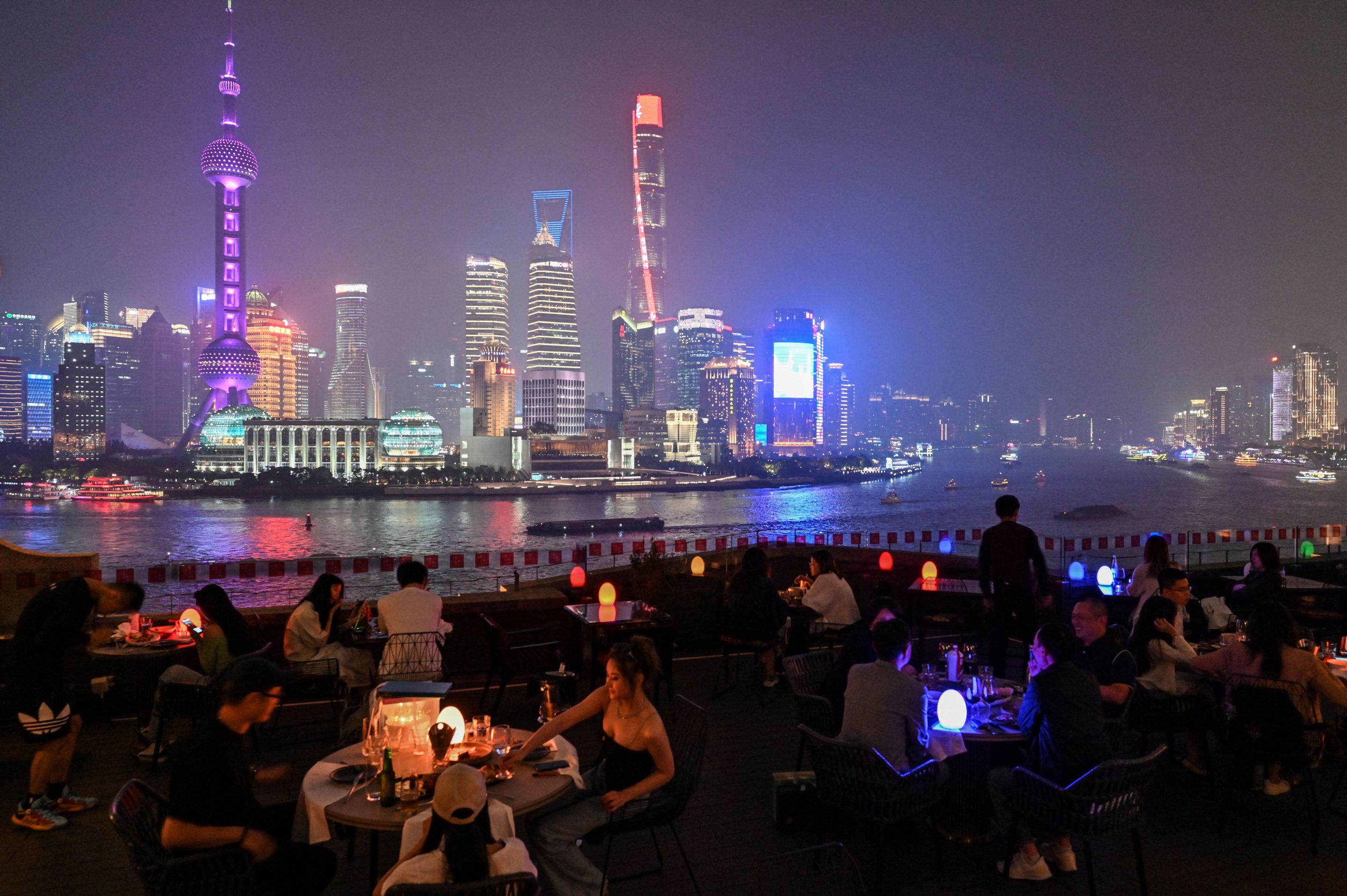 People having dinner at a rooftop restaurant in Shanghai on May 25, 2021.