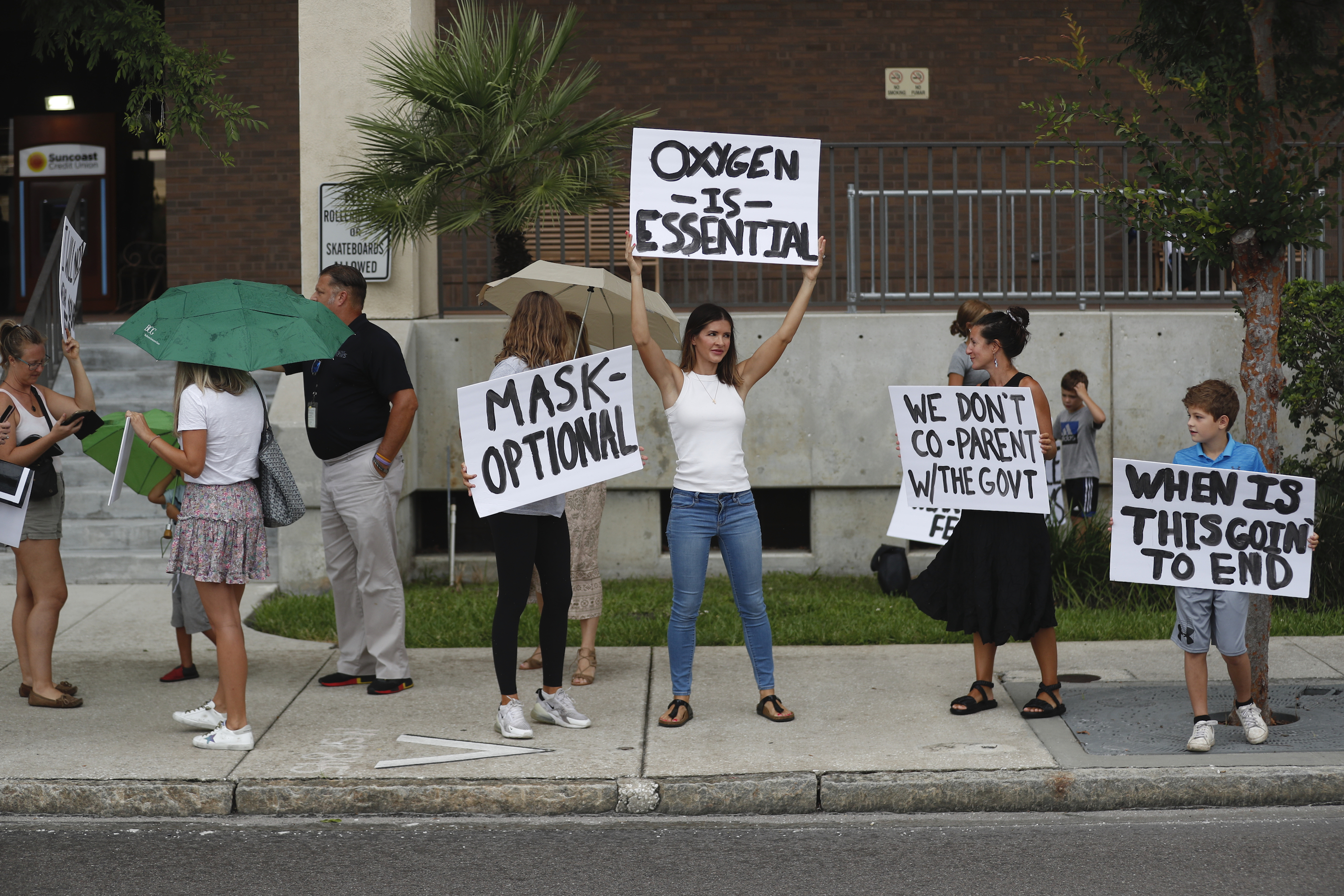 Families protest potential mask mandates before a Hillsborough County Public Schools board meeting in Tampa.