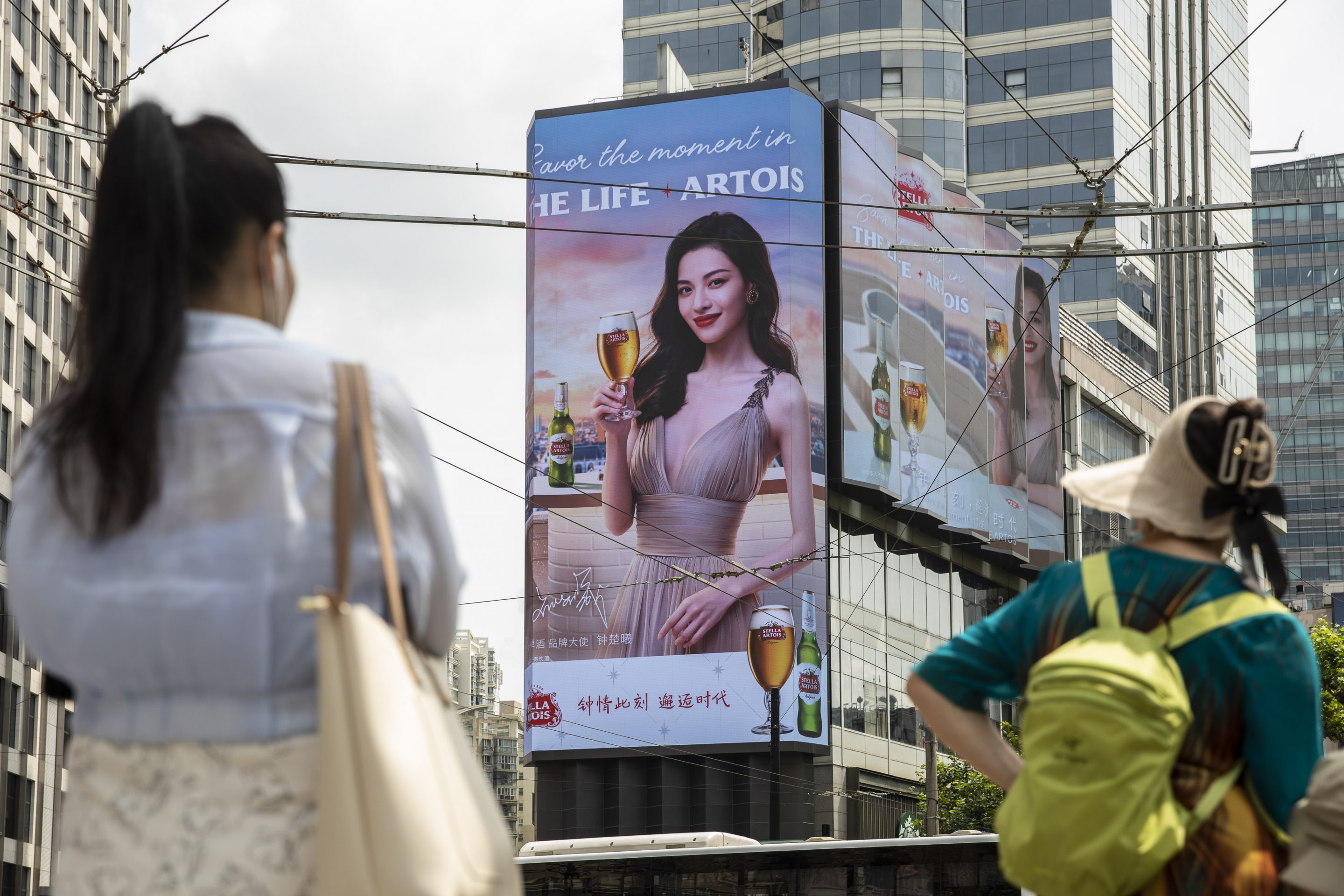 A public screen displays an advertisement for Stella Artois beer in Shanghai, China on Aug. 18, 2021.