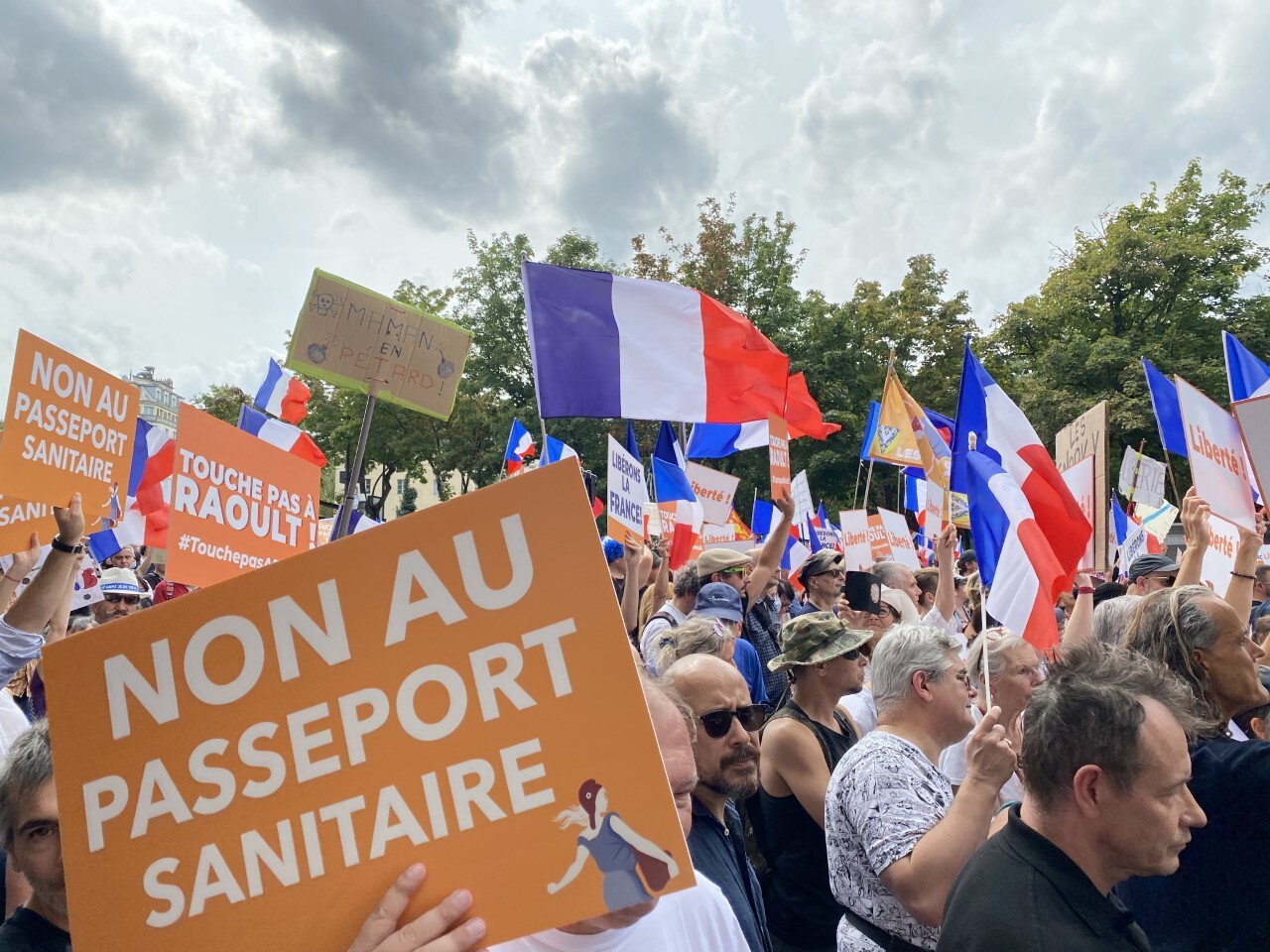 People gather to protest against the vaccination requirement for some professions and the implementation of the COVID-19 health license at the Place du Châtelet in Paris, on Aug. 21, 2021.