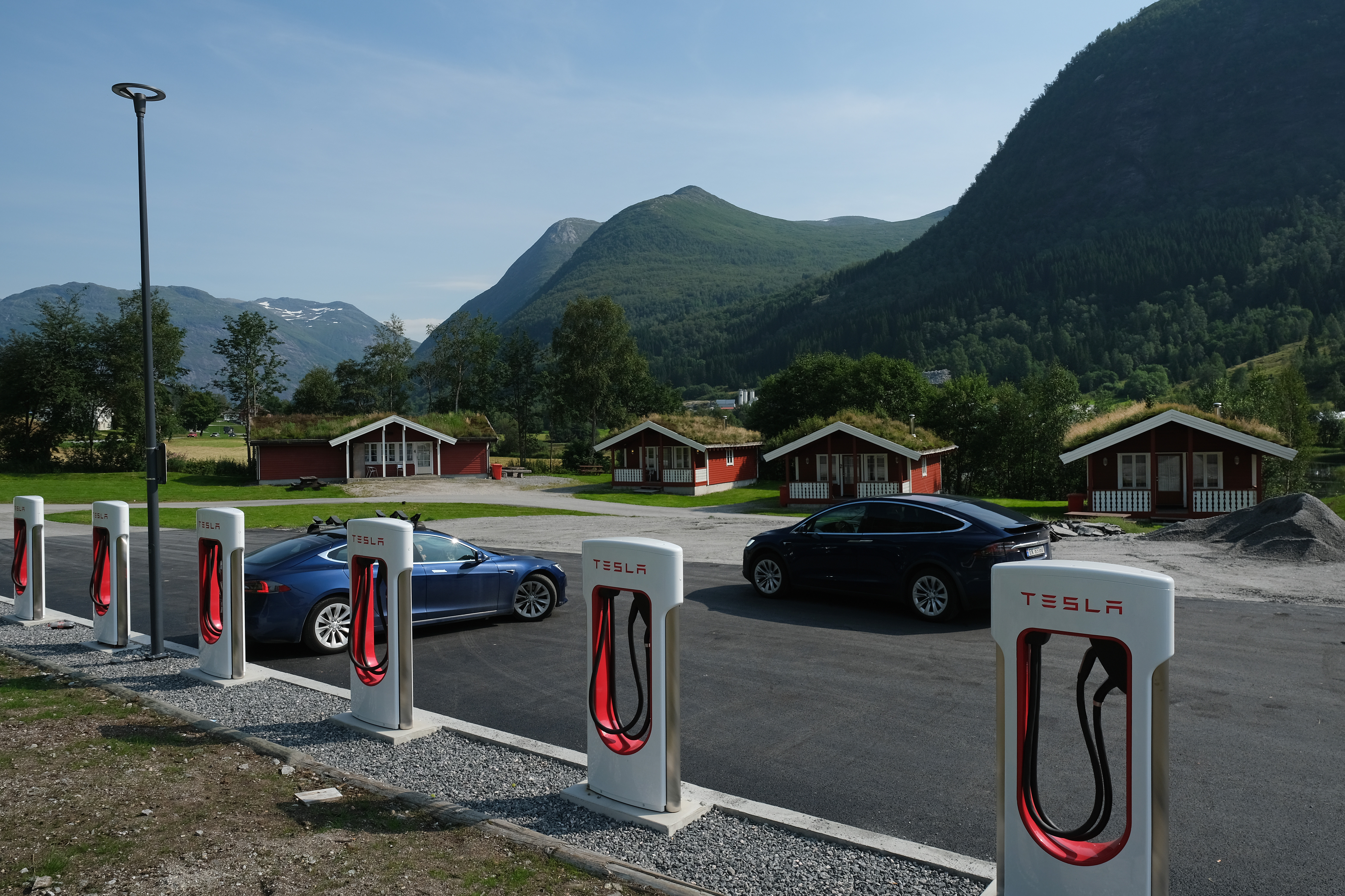 Tesla cars stand at a Tesla Supercharger charging station in Skei, Norway. Norway has the highest percentage of electric cars per capita in the world. The United States—one of the lowest.