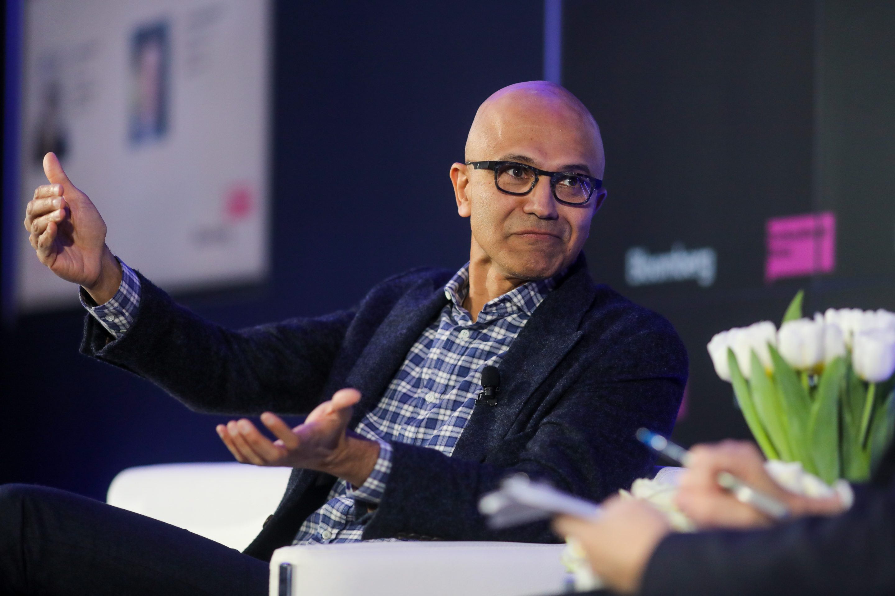 Satya Nadella, chief executive officer of Microsoft Corp., gestures as he speaks during a Bloomberg event on the opening day of the World Economic Forum (WEF) in Davos, Switzerland, on Tuesday, Jan. 21, 2020.