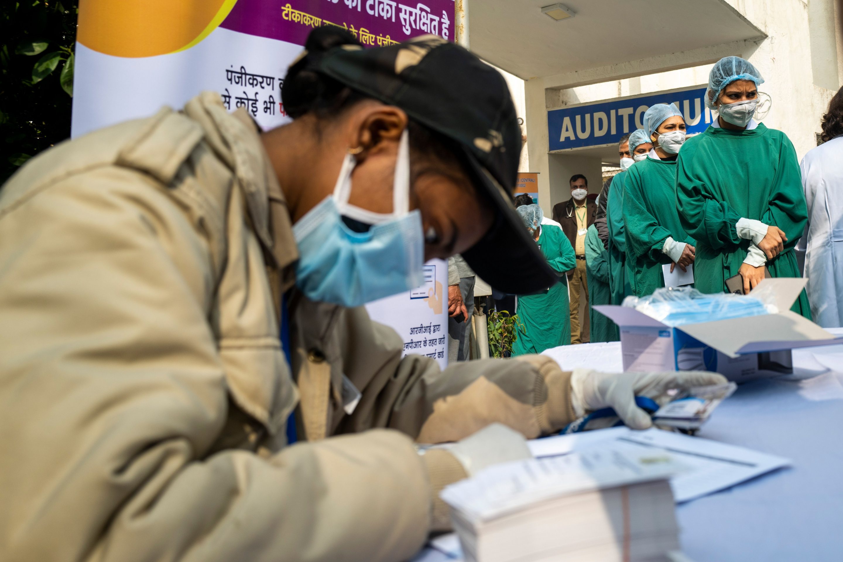 Medical workers wait to be inoculated with a COVID-19 coronavirus vaccine at a hospital in New Delhi on January 16, 2021.