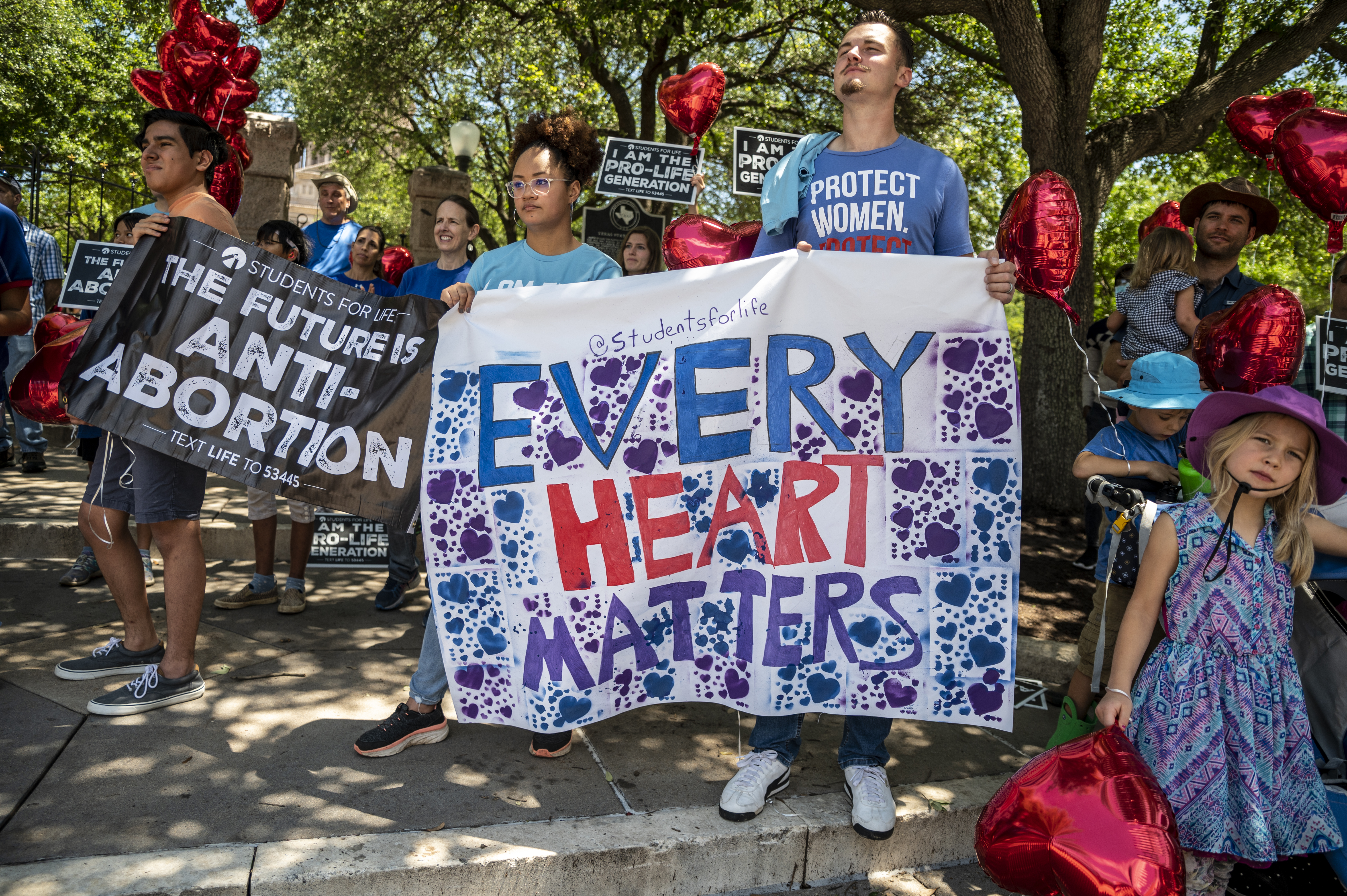 Pro-life protesters stand near the gate of the Texas state capitol at a protest outside the Texas state capitol on May 29, 2021 in Austin, Texas. Thousands of protesters came out in response to the new bill, now a law, outlawing abortions after a fetal heartbeat is detected.