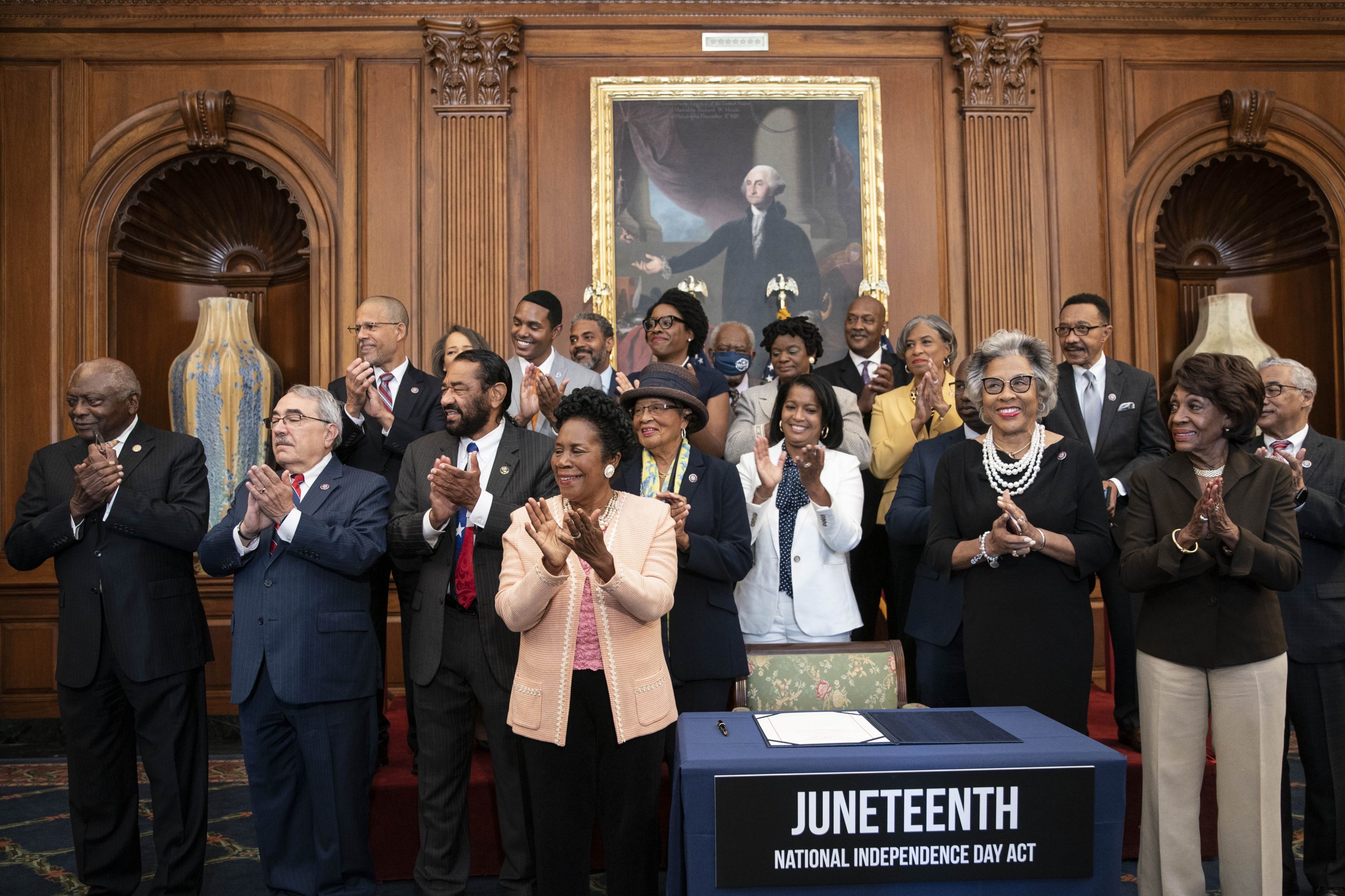 Members of the Congressional Black Caucus during a bill enrollment ceremony in Washington, D.C. "CBC leaders are all too aware of the deficits the Black community faces, and they are advancing legislation today to seeks to address them," writes Robert F. Smith.