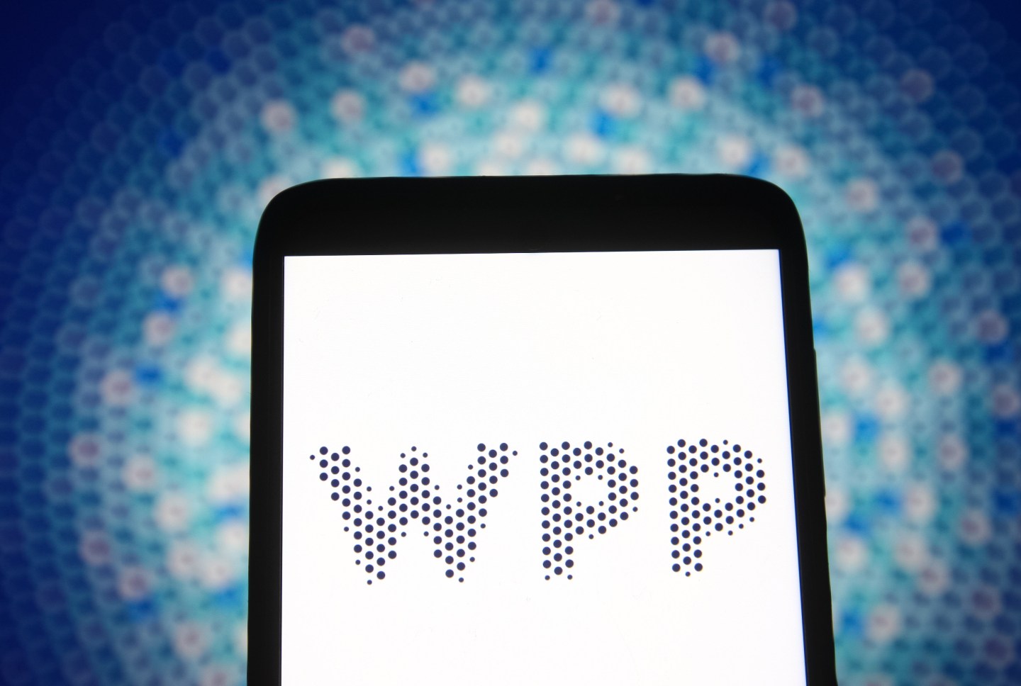 In this photo illustration a WPP logo of a British communication company is seen on a smartphone screen.