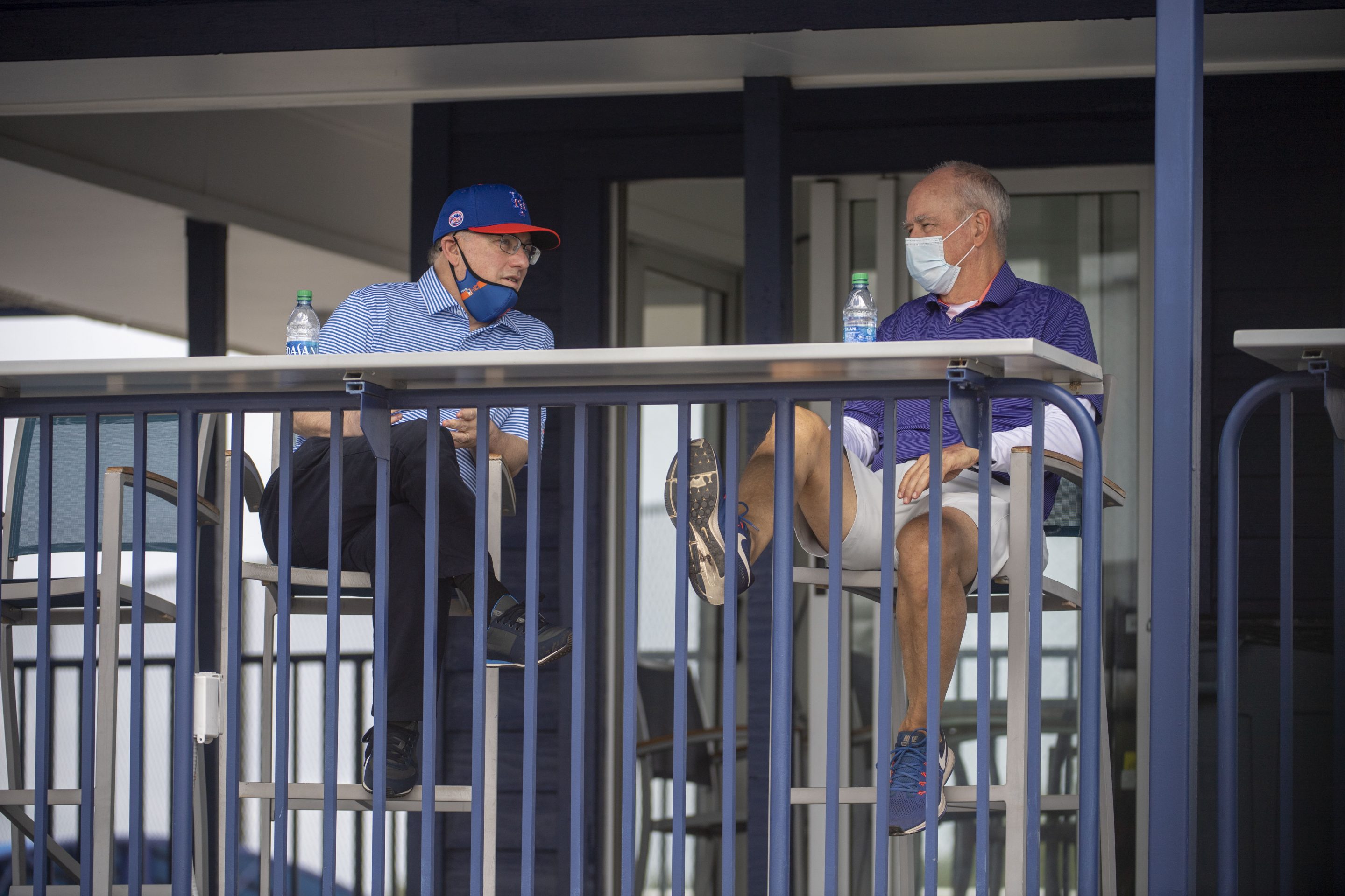 New York Mets owner Steven A. Cohen (left) and general manager Sandy Alderson chat during a spring training workout in Port St. Lucie, Fla., in February.