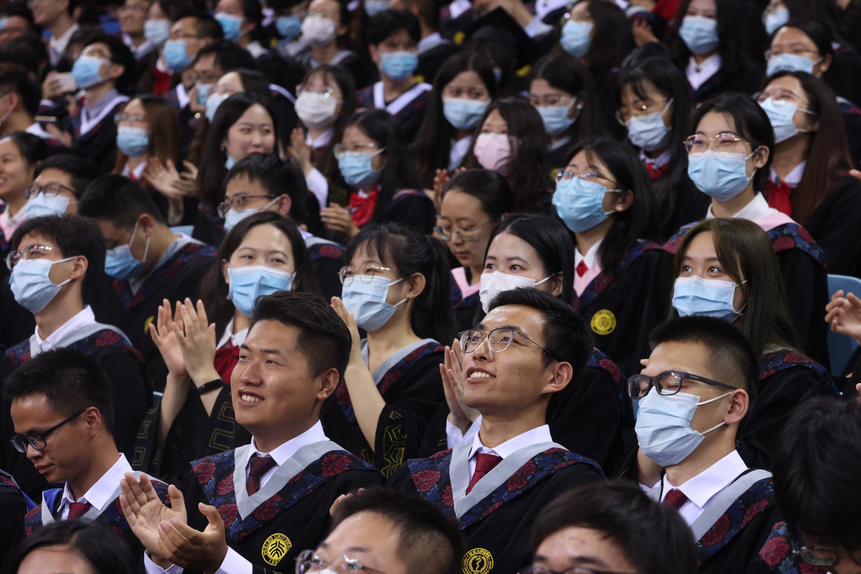 Graduates attend a graduation ceremony at Peking University on July 13, 2021 in Beijing, China.