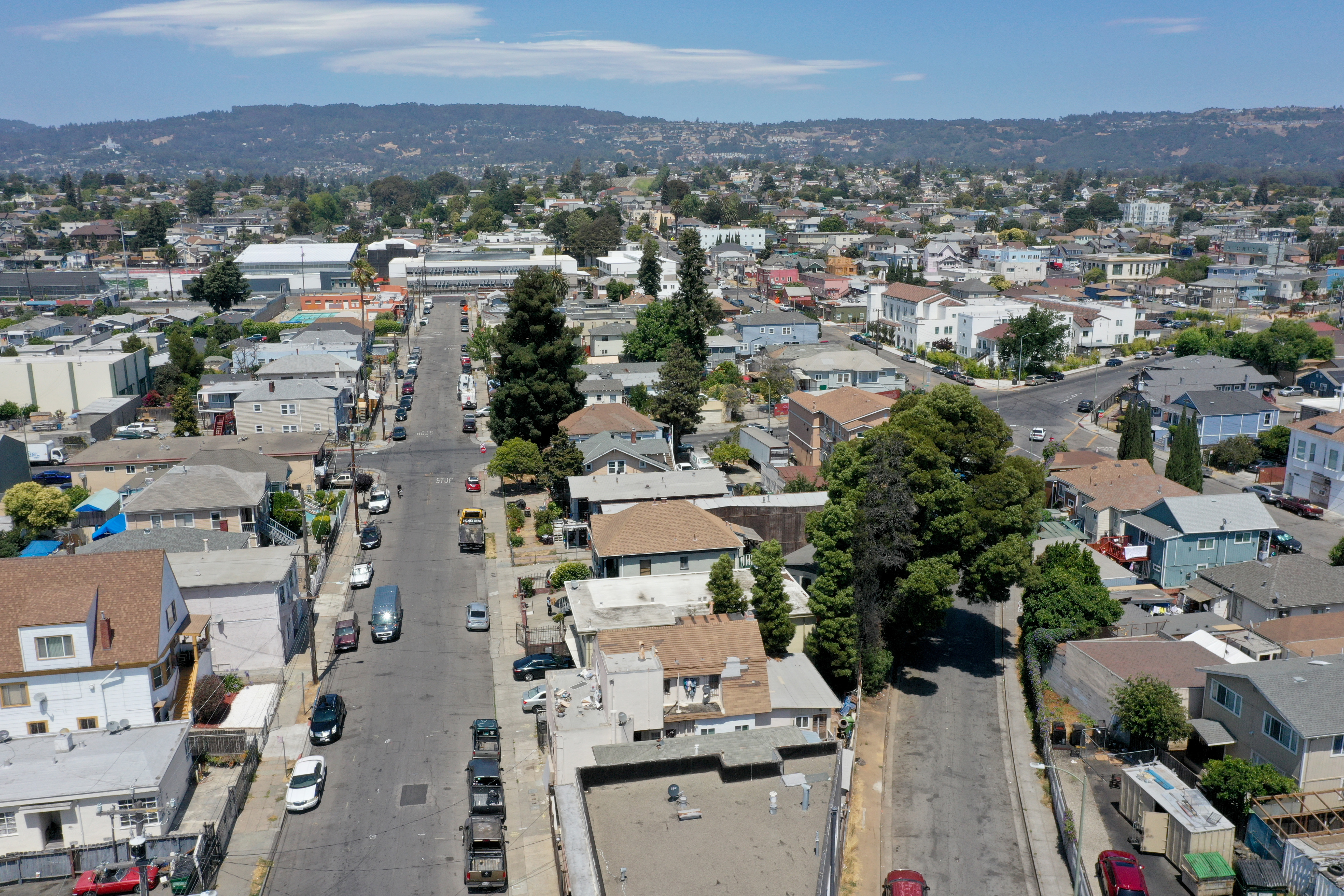 A neighborhood in East Oakland, Calif., on, July 19, 2021. Poor neighborhoods, just miles from rich ones, can be as much as 7 degrees hotter on the same day due to lack of tree cover.