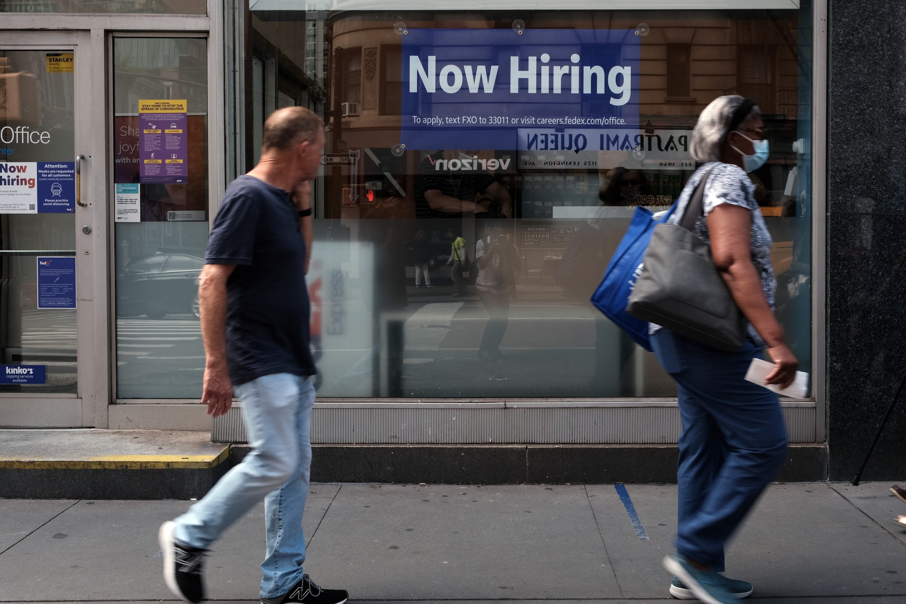 A help wanted sign in a store window in New York City this summer. The current low unemployment rate doesn’t reflect broader structural challenges for the labor force.