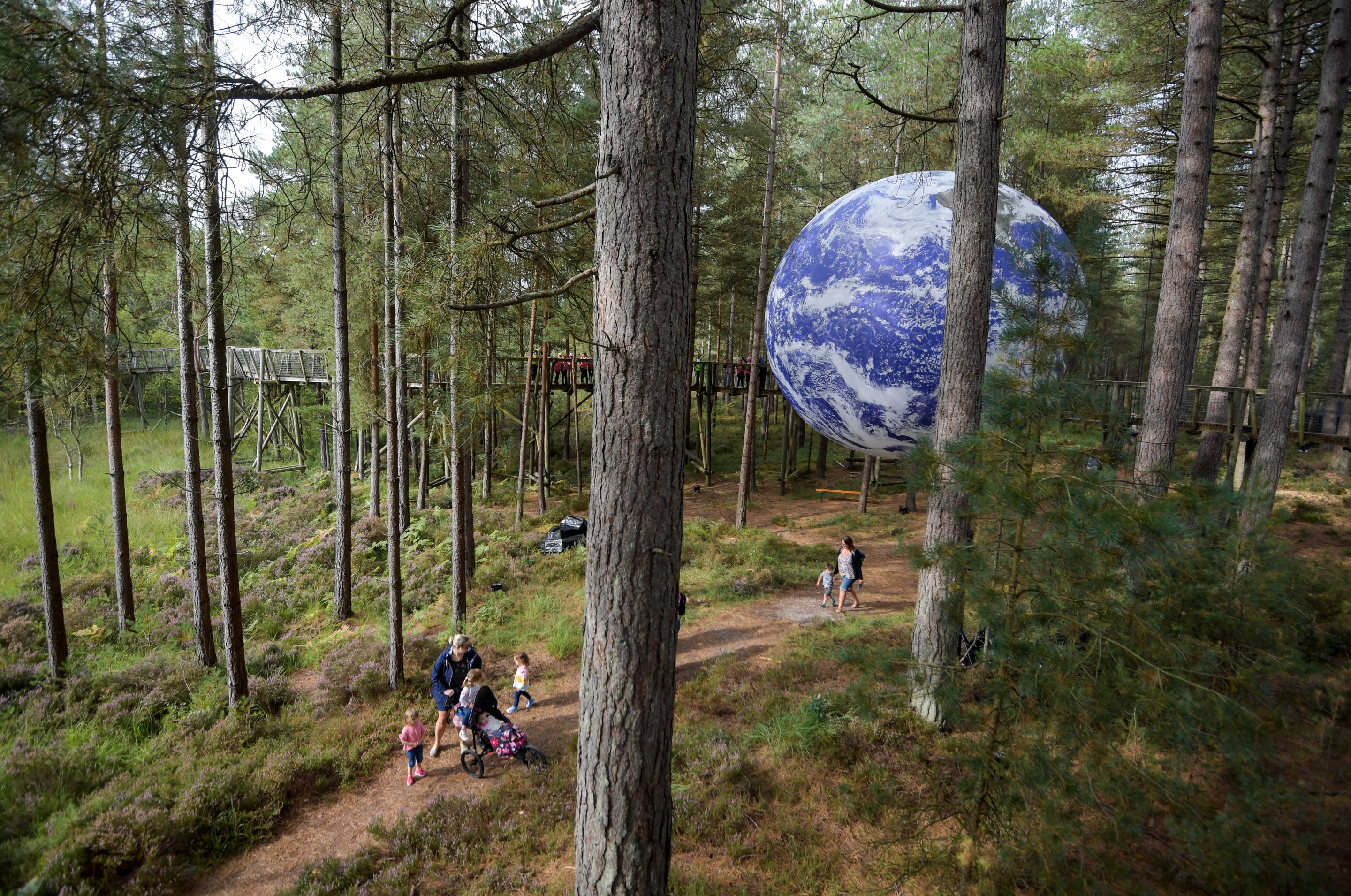 Luke Jerram's installation 'Gaia', a seven-meter replica of planet Earth,  at Moors Valley Country Park and Forest, UK.