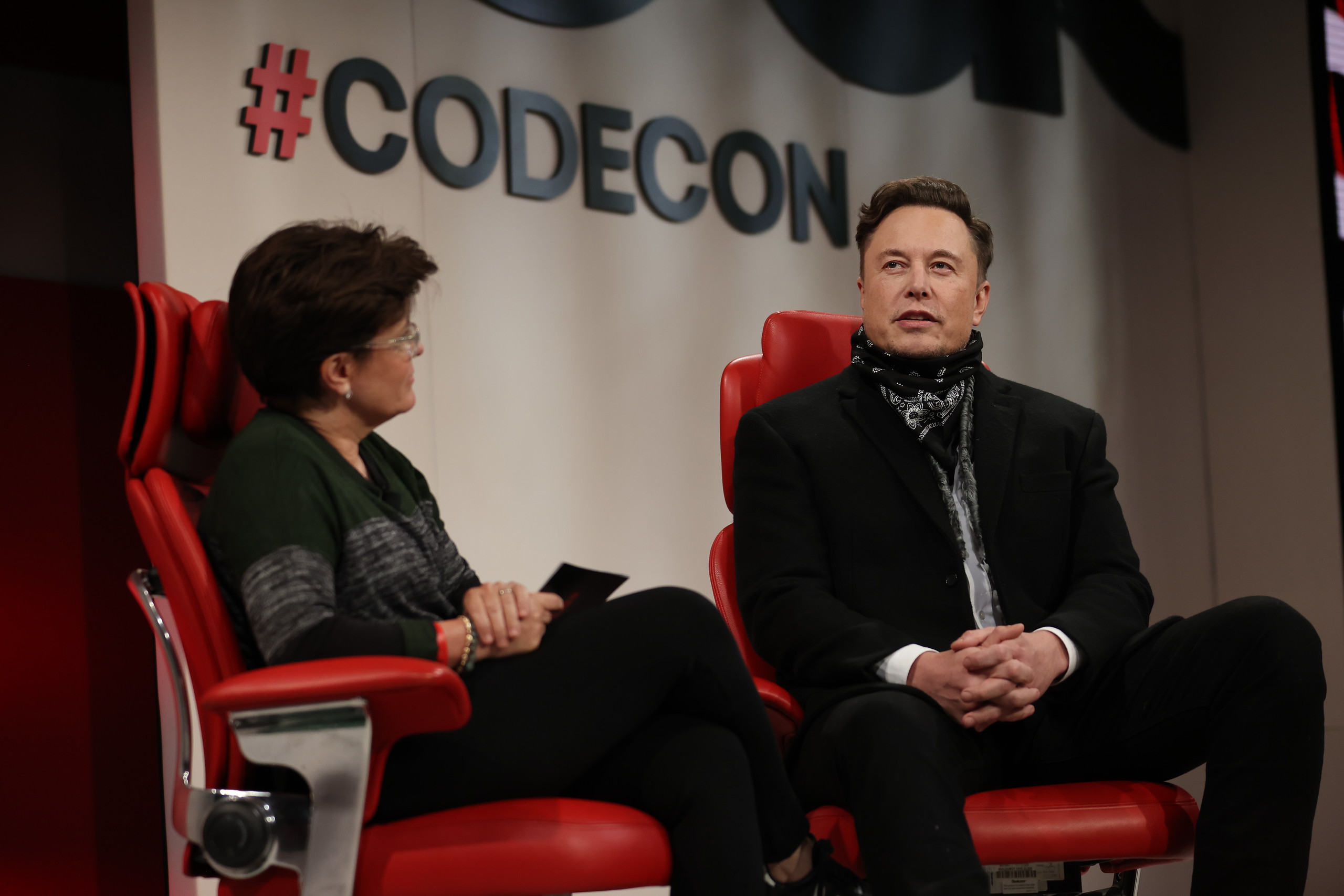 Elon Musk (right) speaks onstage at the 2021 Code Conference in Beverly Hills, Calif., on September 28.