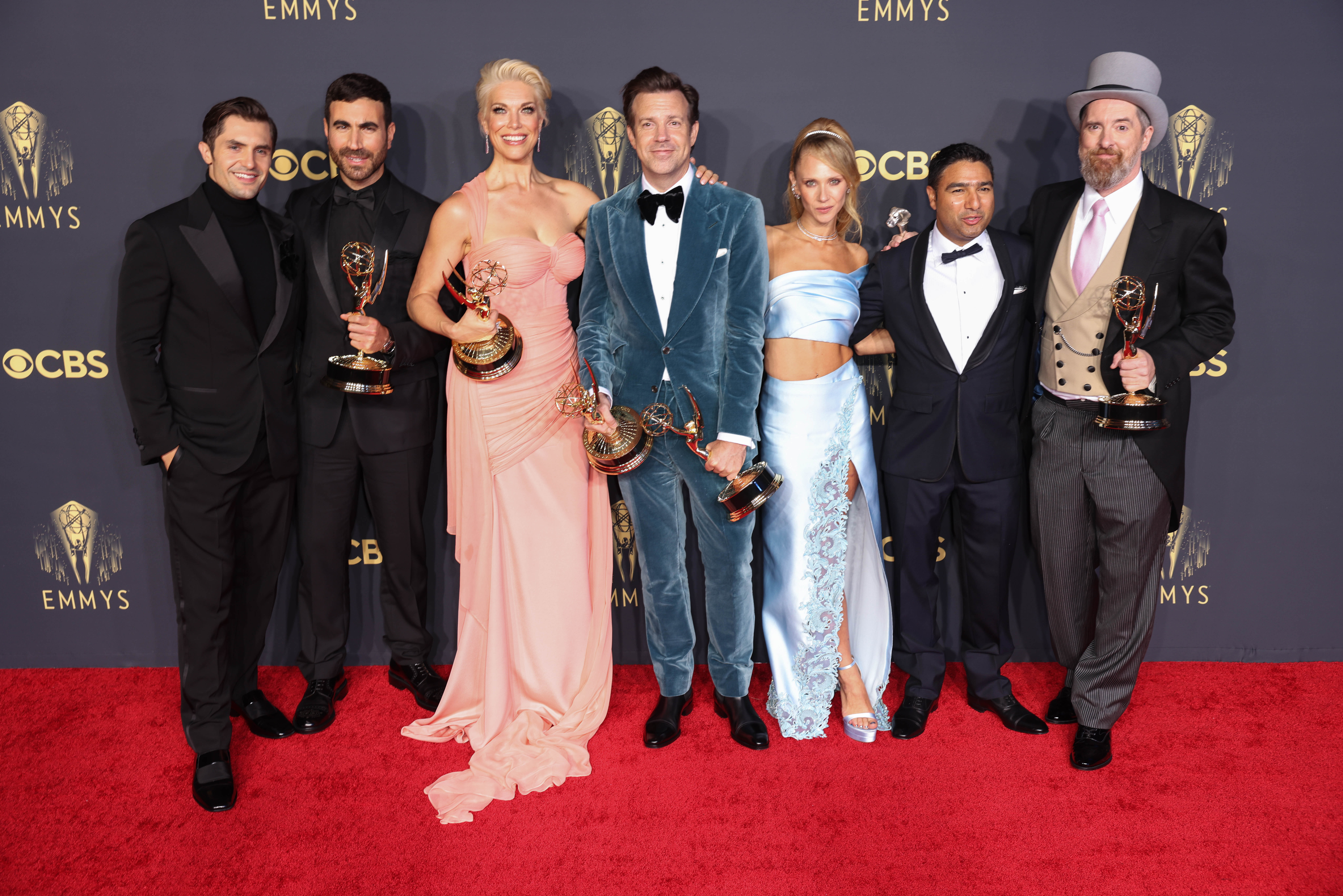 Phil Dunster, Brett Goldstein, Hannah Waddingham, Jason Sudeikis, Juno Temple, Nick Mohammed, and Brendan Hunt, winners of Outstanding Comedy Series for 'Ted Lasso,' pose in the press room during the 73rd Primetime Emmy Awards on Sept. 19, 2021 in Los Angeles.