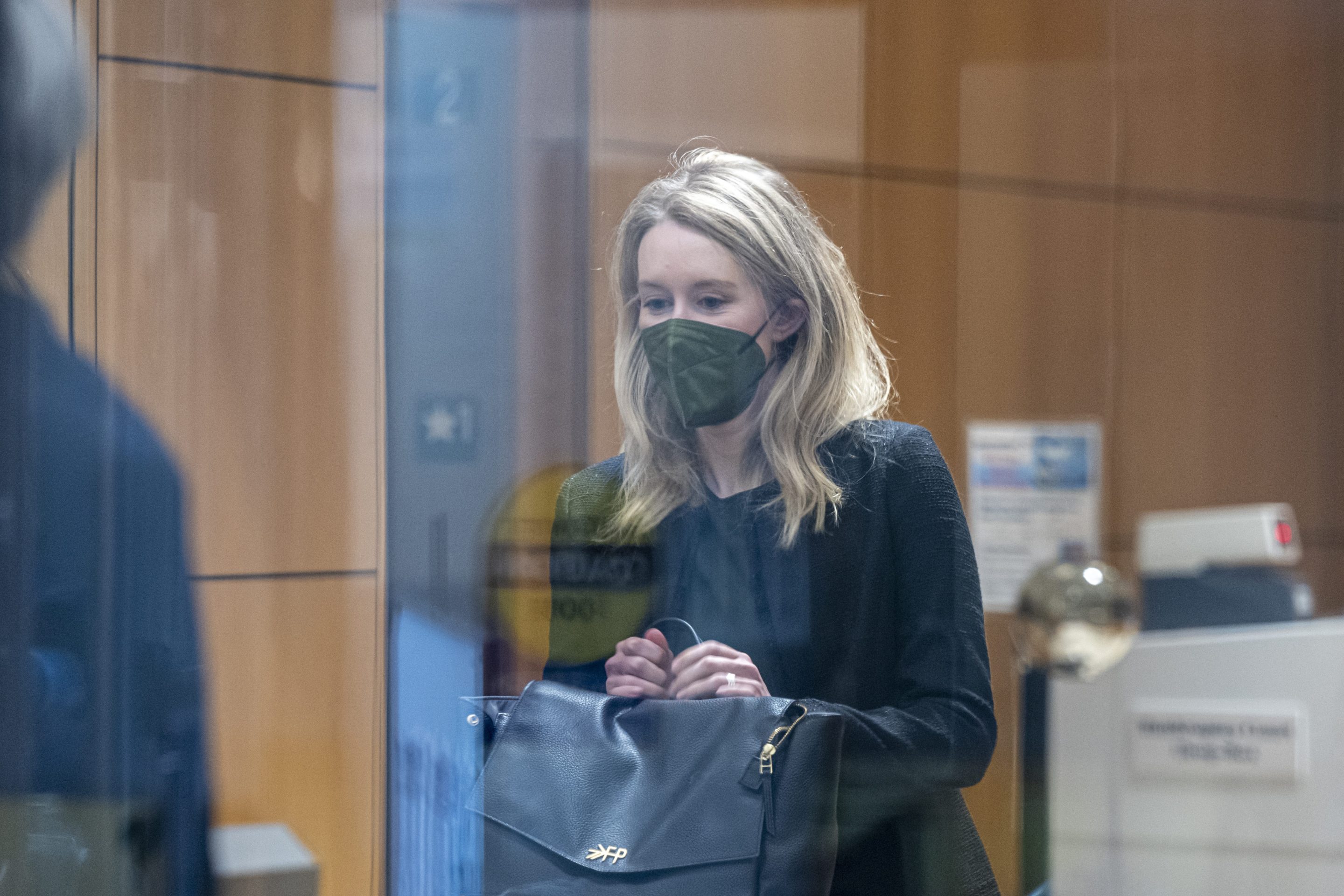 Theranos founder Elizabeth Holmes arrives at federal court in San Jose, Calif., on Oct. 12.