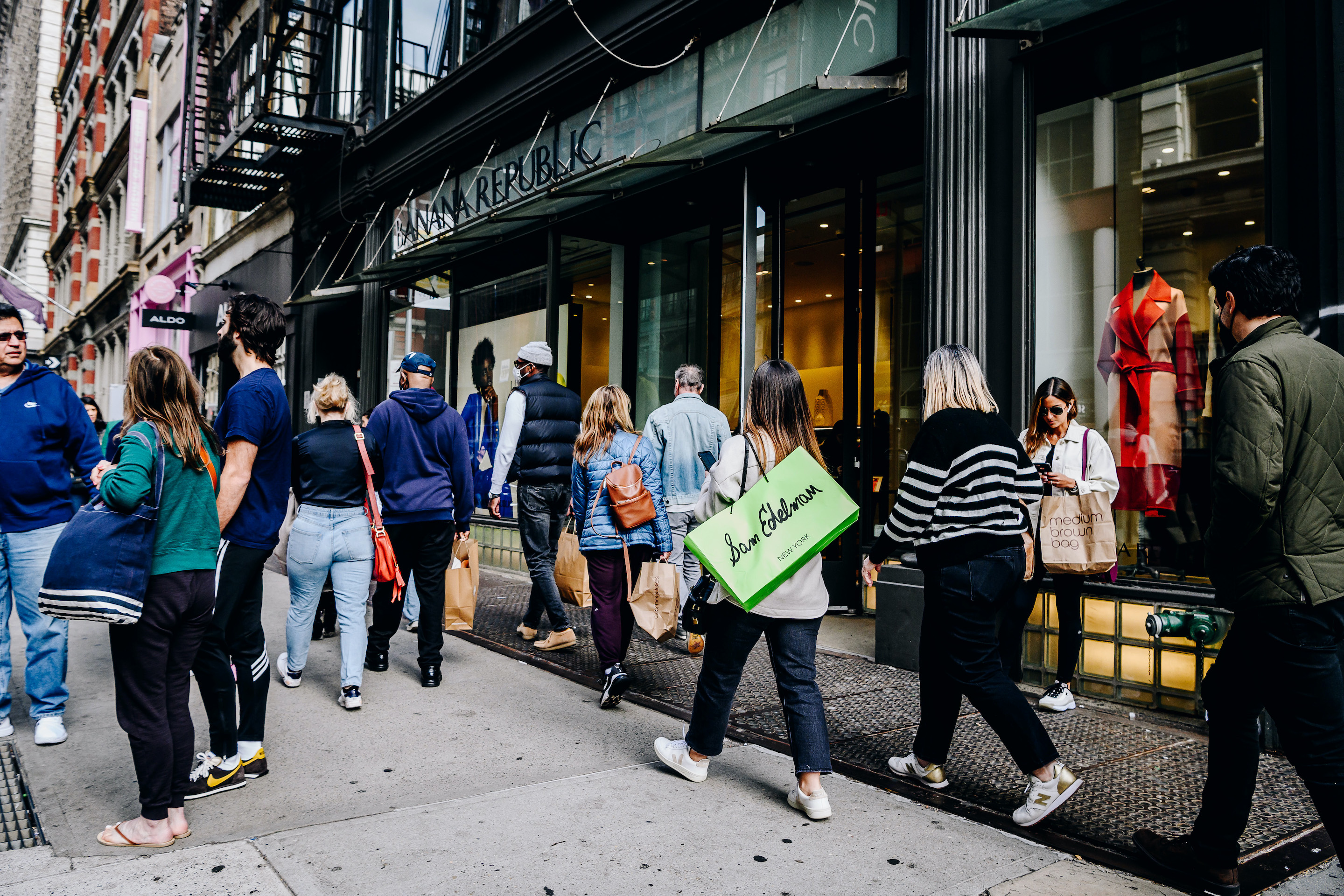 Pedestrians carrying shopping bags in the SoHo neighborhood of New York City on Oct. 24, 2021.