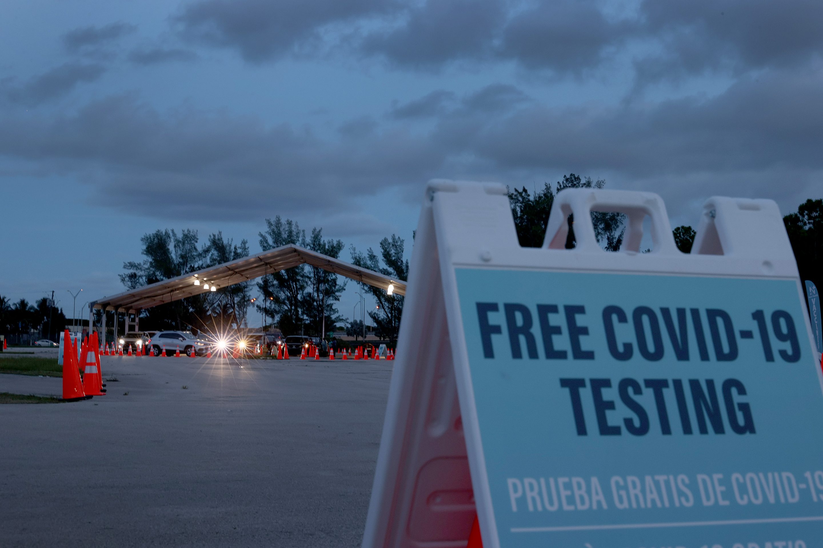 MIAMI, FLORIDA - AUGUST 30: Healthcare workers at a 24-hour drive-thru site set up by Miami-Dade and Nomi Health in Tropical Park administer COVID-19 tests on August 30, 2021 in Miami, Florida. Miami-Dade County and Nomi Health opened the round-the-clock testing site in response to the rising number of COVID-19 cases in the state, driven predominantly by the Delta variant. In the last week of September and early October Florida has expereinced a 50% drop in new COVID cases, the largest decrease of the 50 states. (Photo by Joe Raedle/Getty Images)