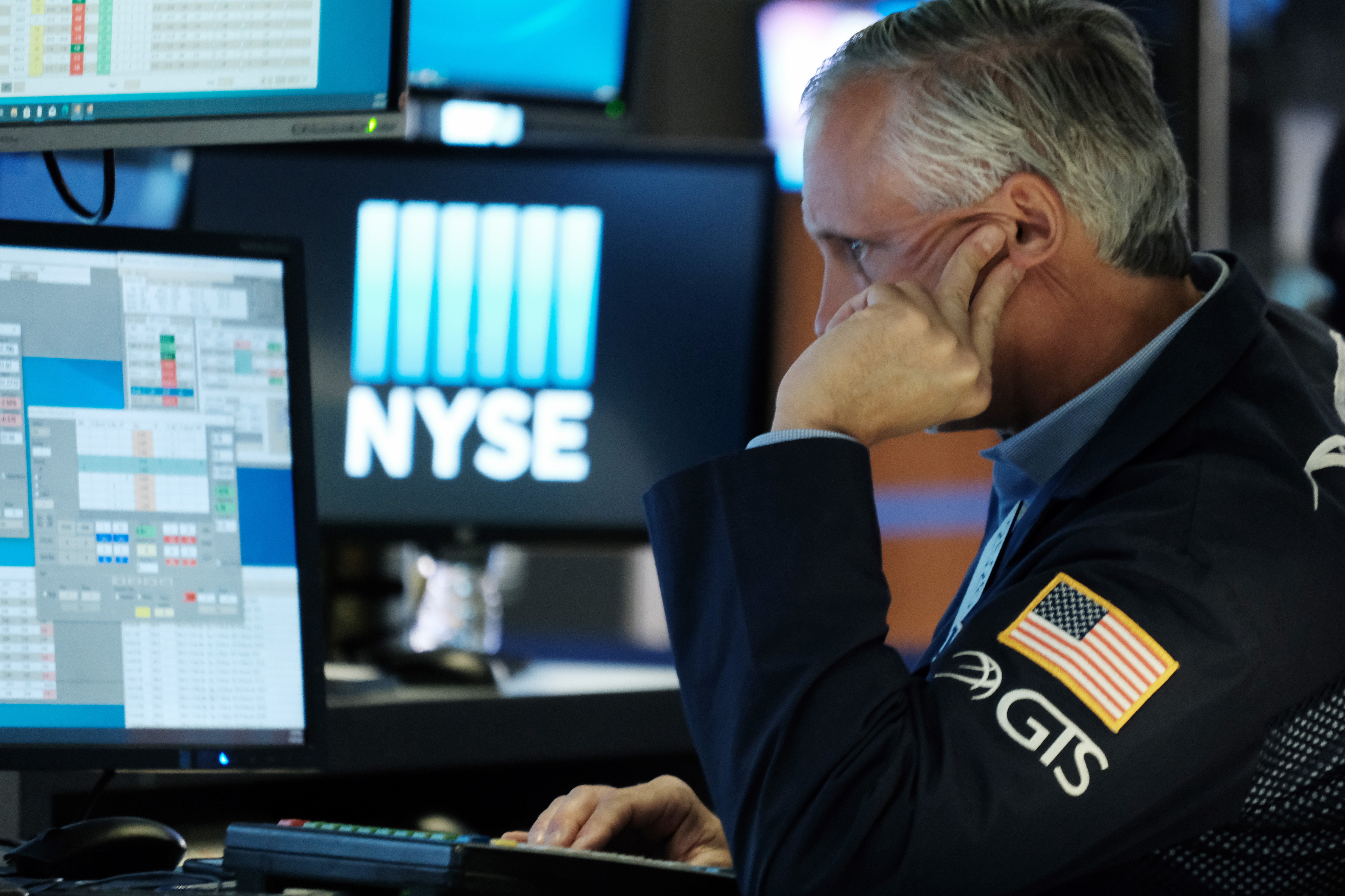 Traders work on the floor of the New York Stock Exchange. Stocks had a lousy September, and are starting off a new month in the red.