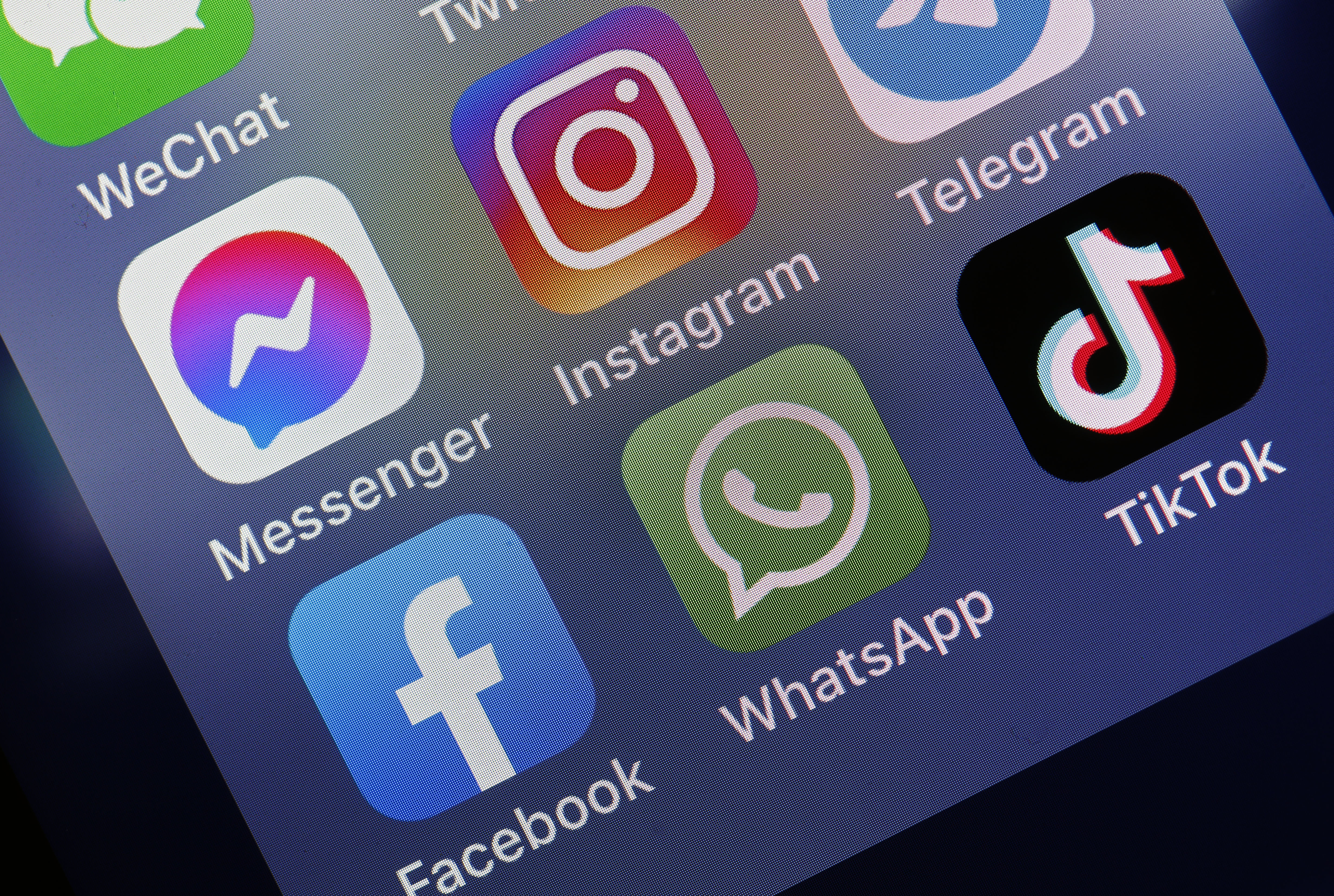 In this photo illustration, the logos of social media applications, Messenger, Instagram, Facebook, WhatsApp and TikTok is displayed on the screen of an iPhone on October 06, 2021 in Paris, France.