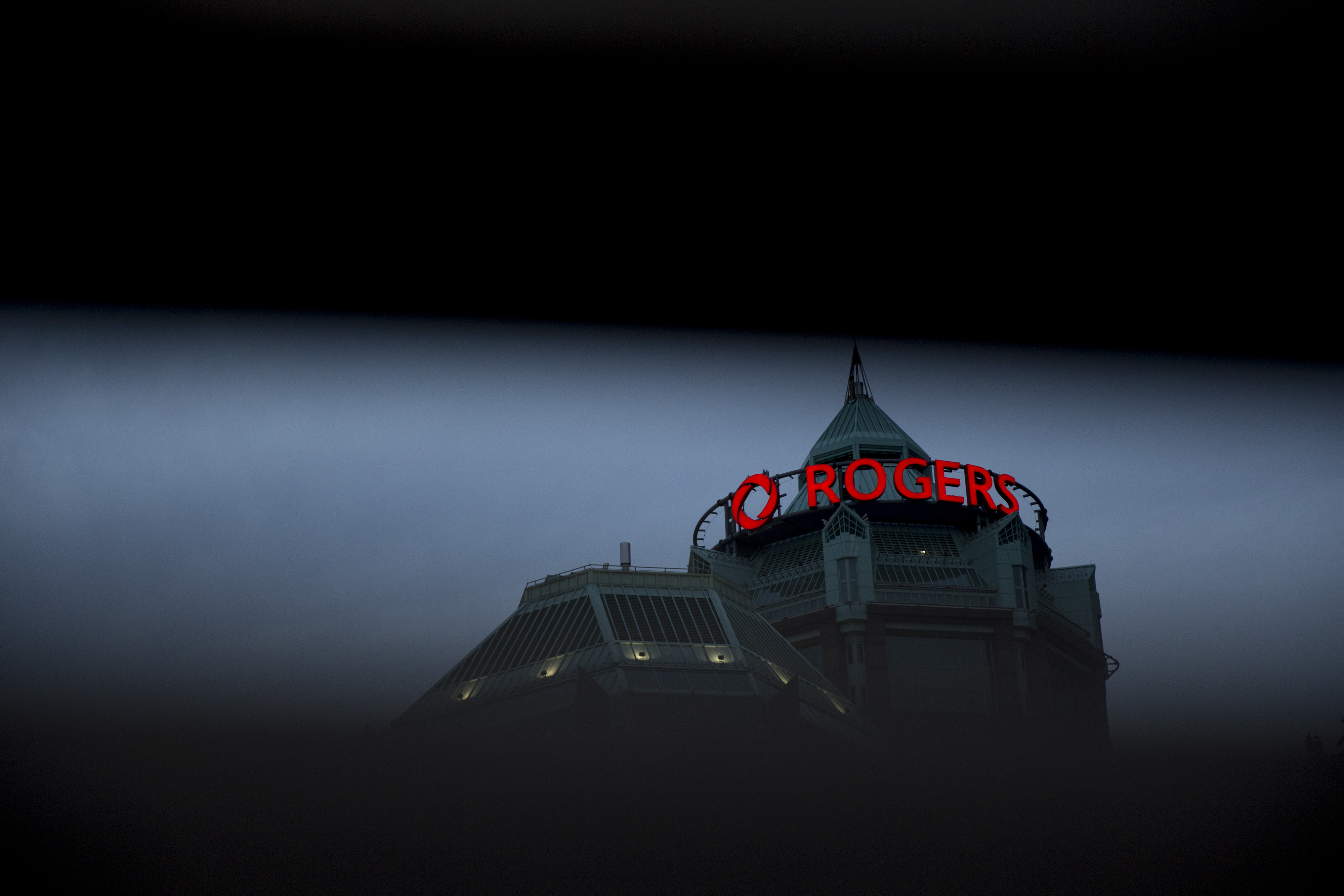 Signage is displayed on the exterior of Rogers Communications Inc. headquarters in Toronto, Ontario, Canada