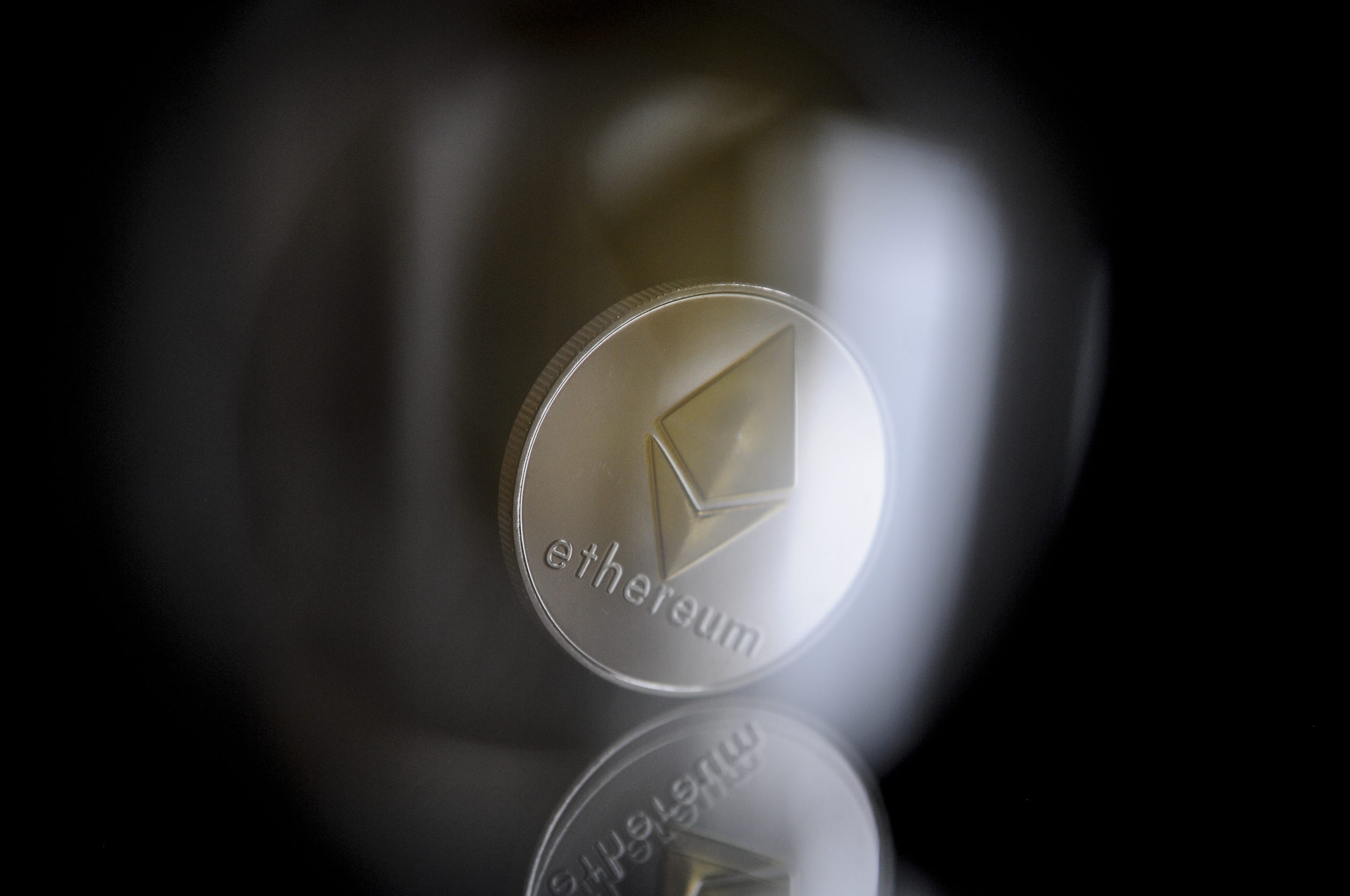 Ether surged to an all-time record amid a broader altcoin rally.