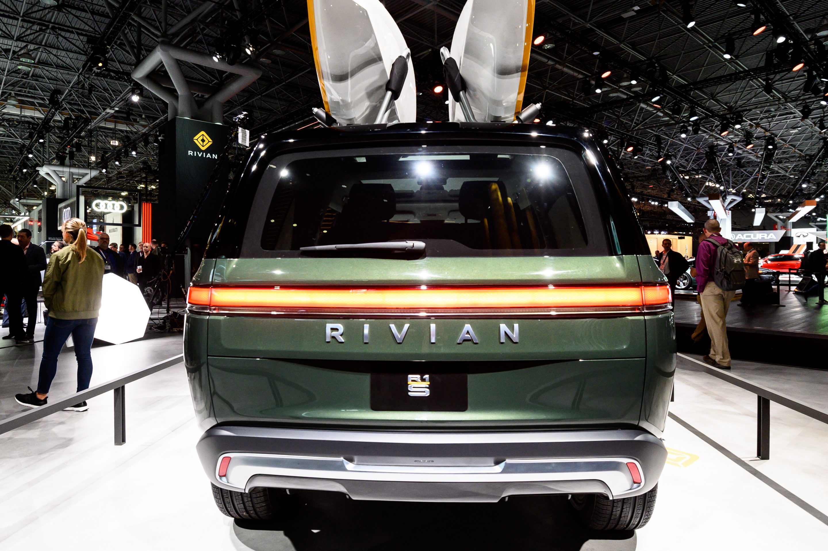 A former executive is suing electric vehicle maker Rivian, alleging gender discrimination.