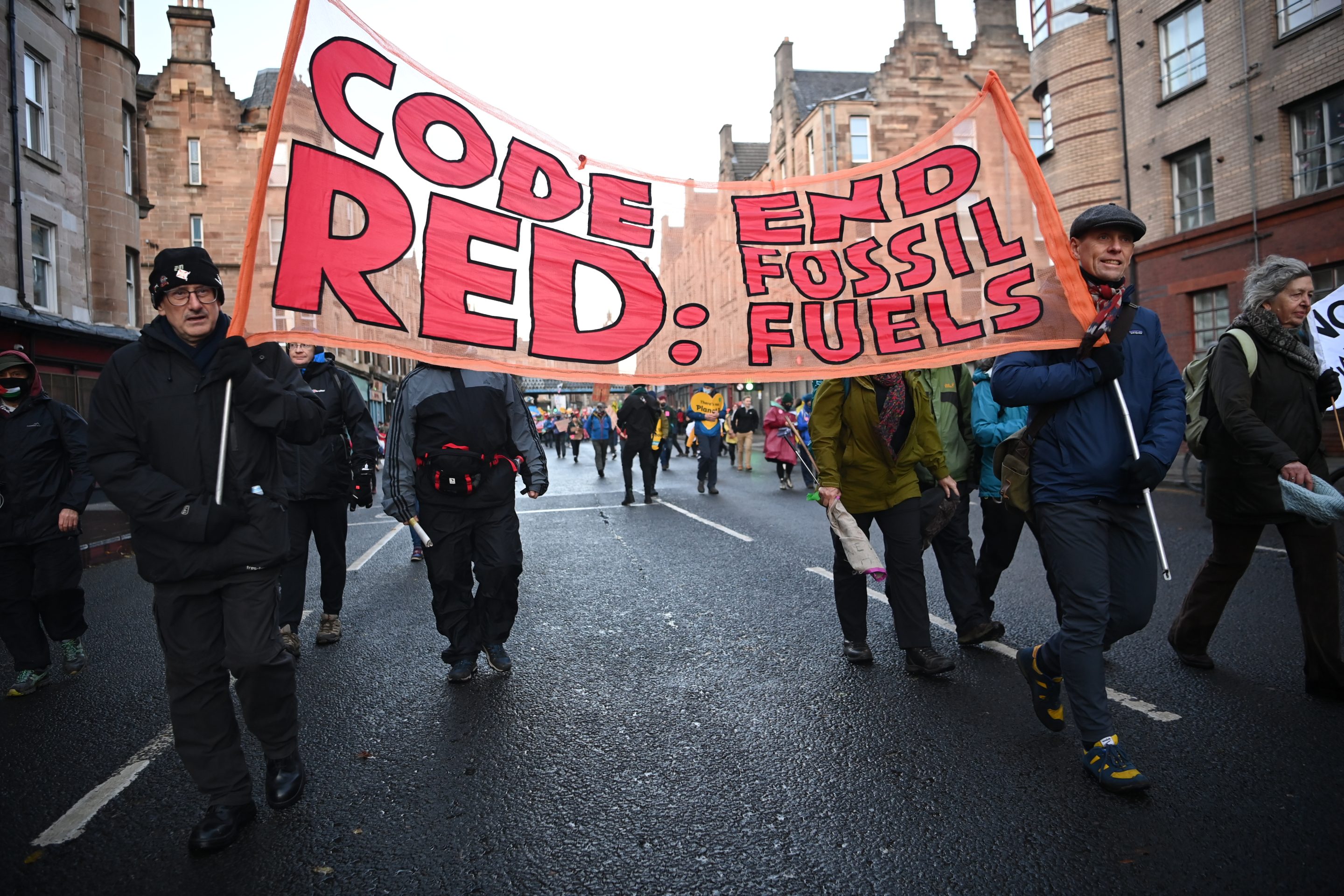 Climate protesters during a march on Nov. 6, 2021 in Glasgow, Scotland. "Companies that do not move boldly may even lose their entire businesses to the existential threat" of climate change, writes Nick Studer.