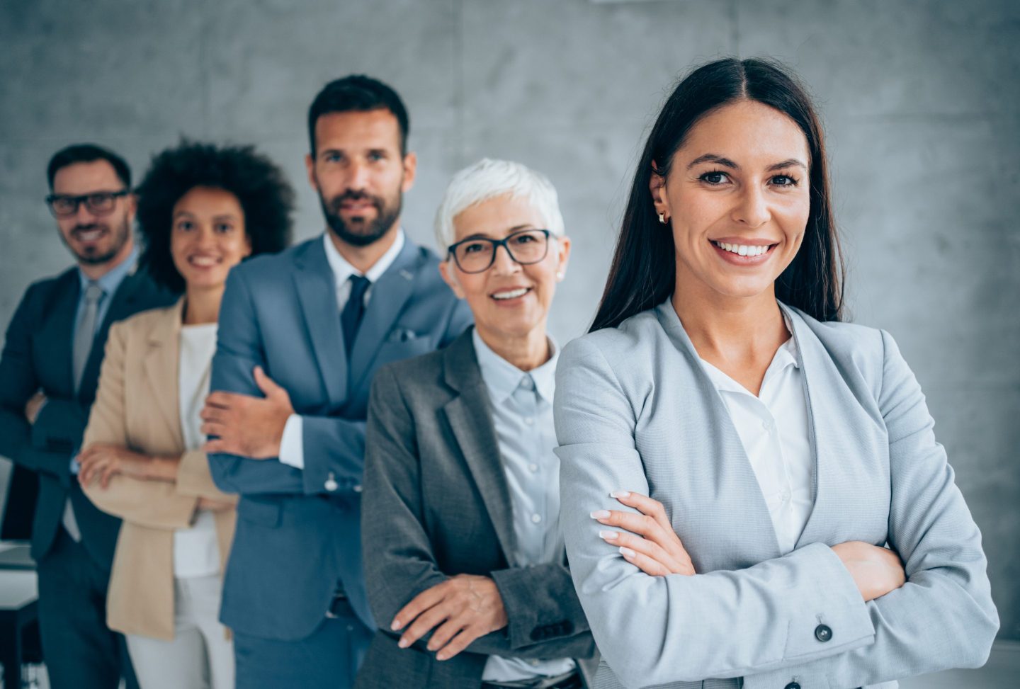 Confident businesswoman and her team.