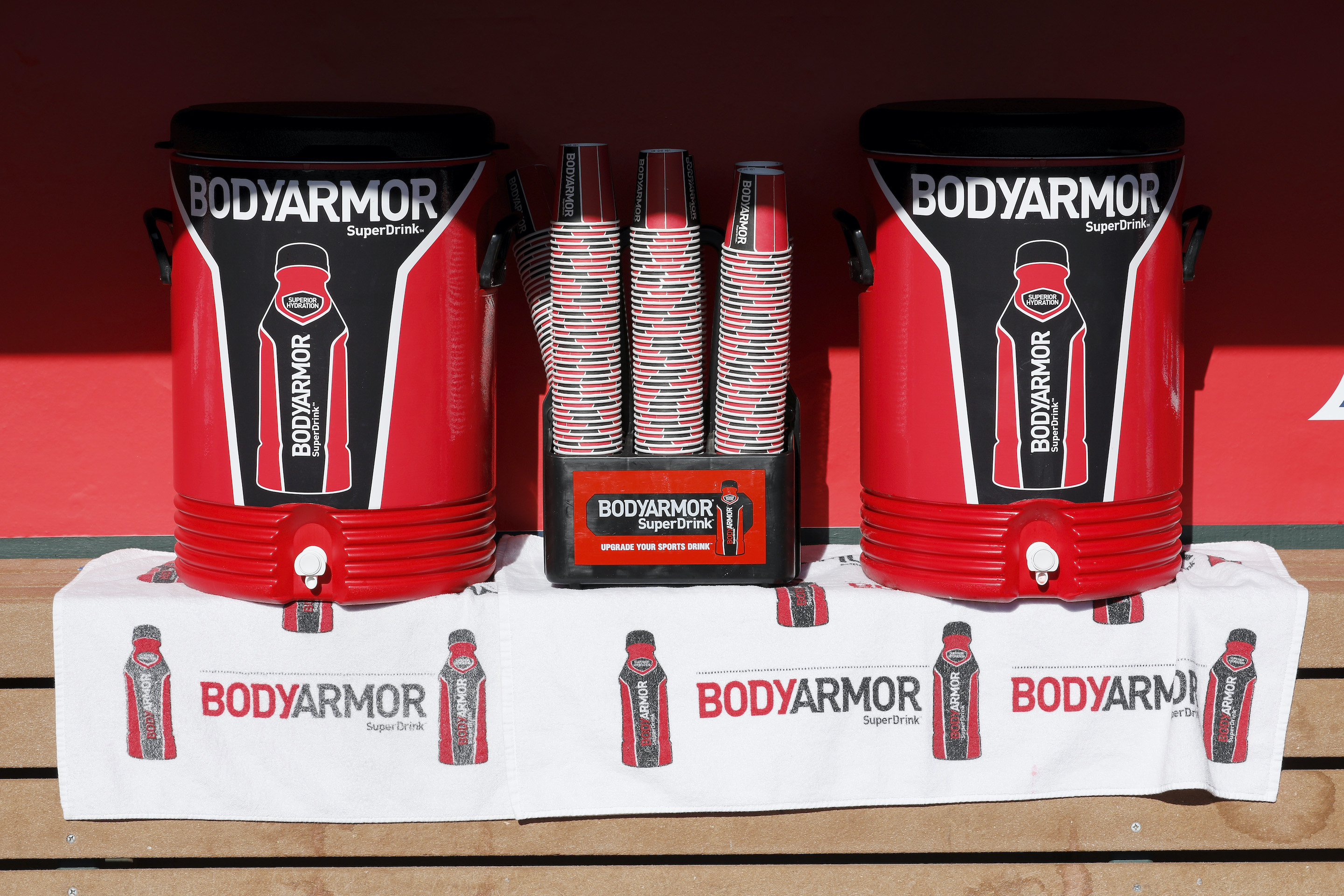 Bodyarmor SuperDrink coolers and cups are seen in the dugout before a spring training game between the Los Angeles Angels of Anaheim and the Chicago Cubs at Tempe Diablo Stadium on March 6, 2017 in Tempe, Arizona.
