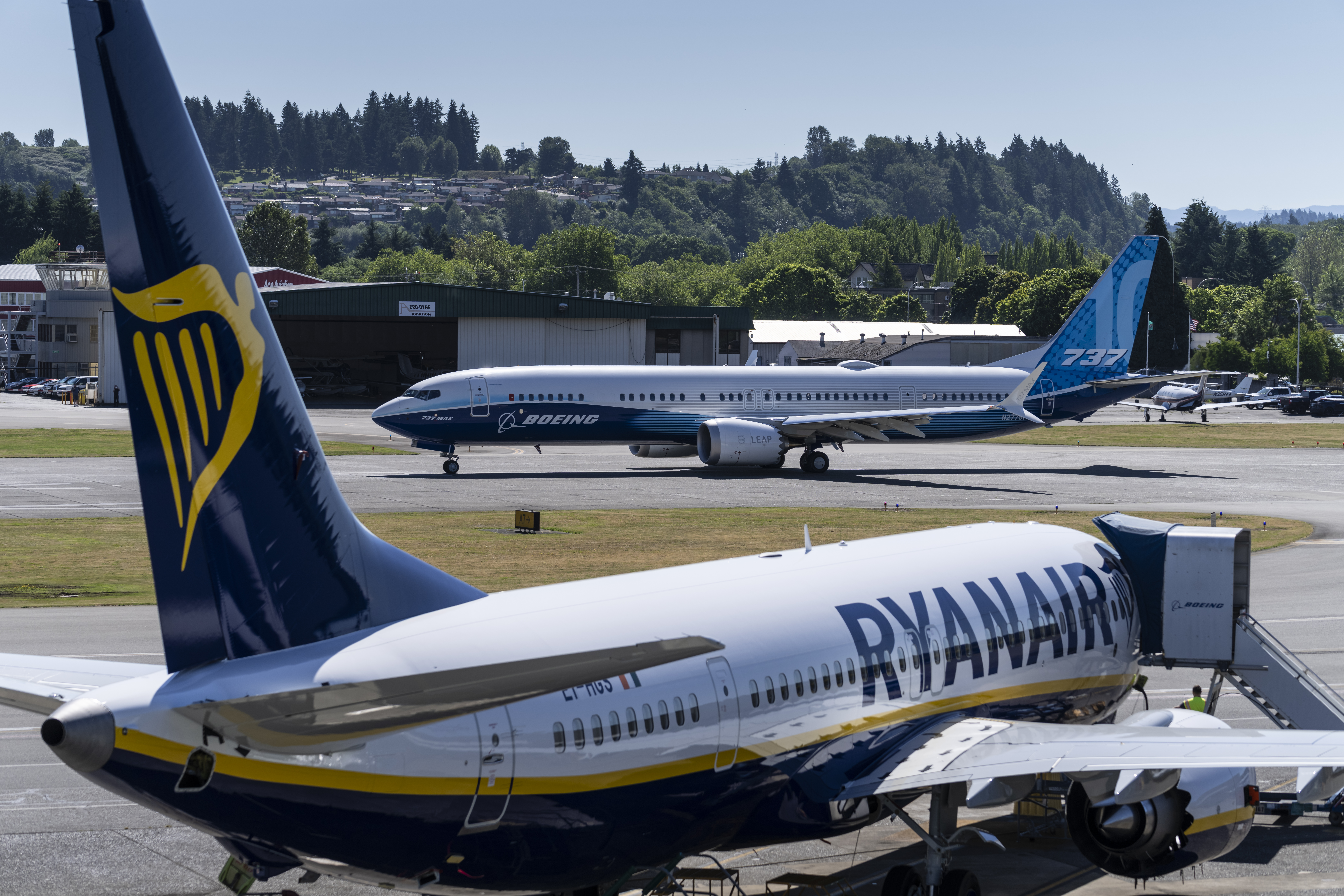 A 737 Max bears the blue and yellow livery of budget airline Ryanair.