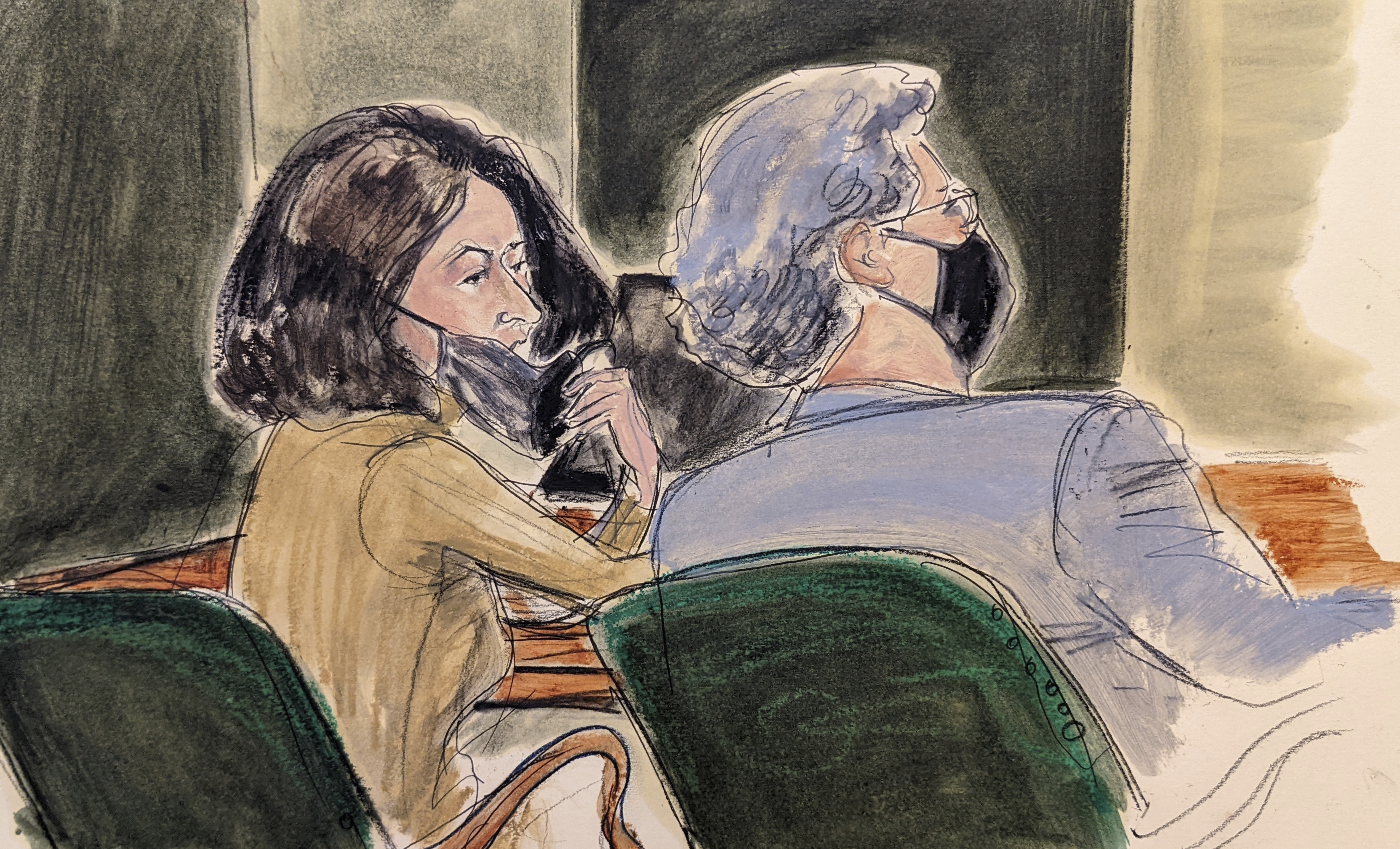 Ghislaine Maxwell, left, pulls down her mask to talk to one of her lawyers, Jeffrey Pagliuca, during Maxwell's sex trafficking trial, Dec. 27, 2021, in New York. 