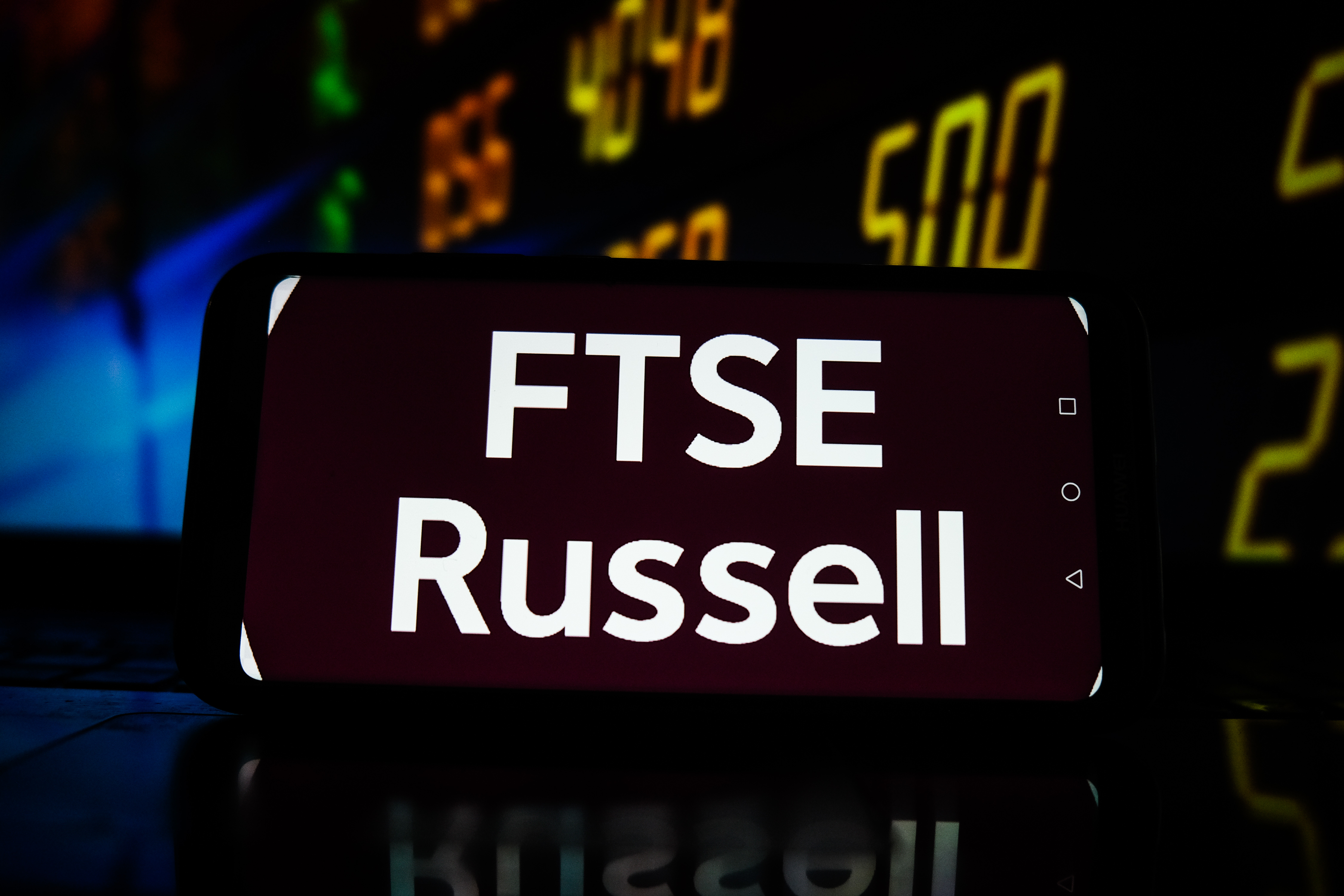 A photo of "FTSE Russell" displayed on smartphone.