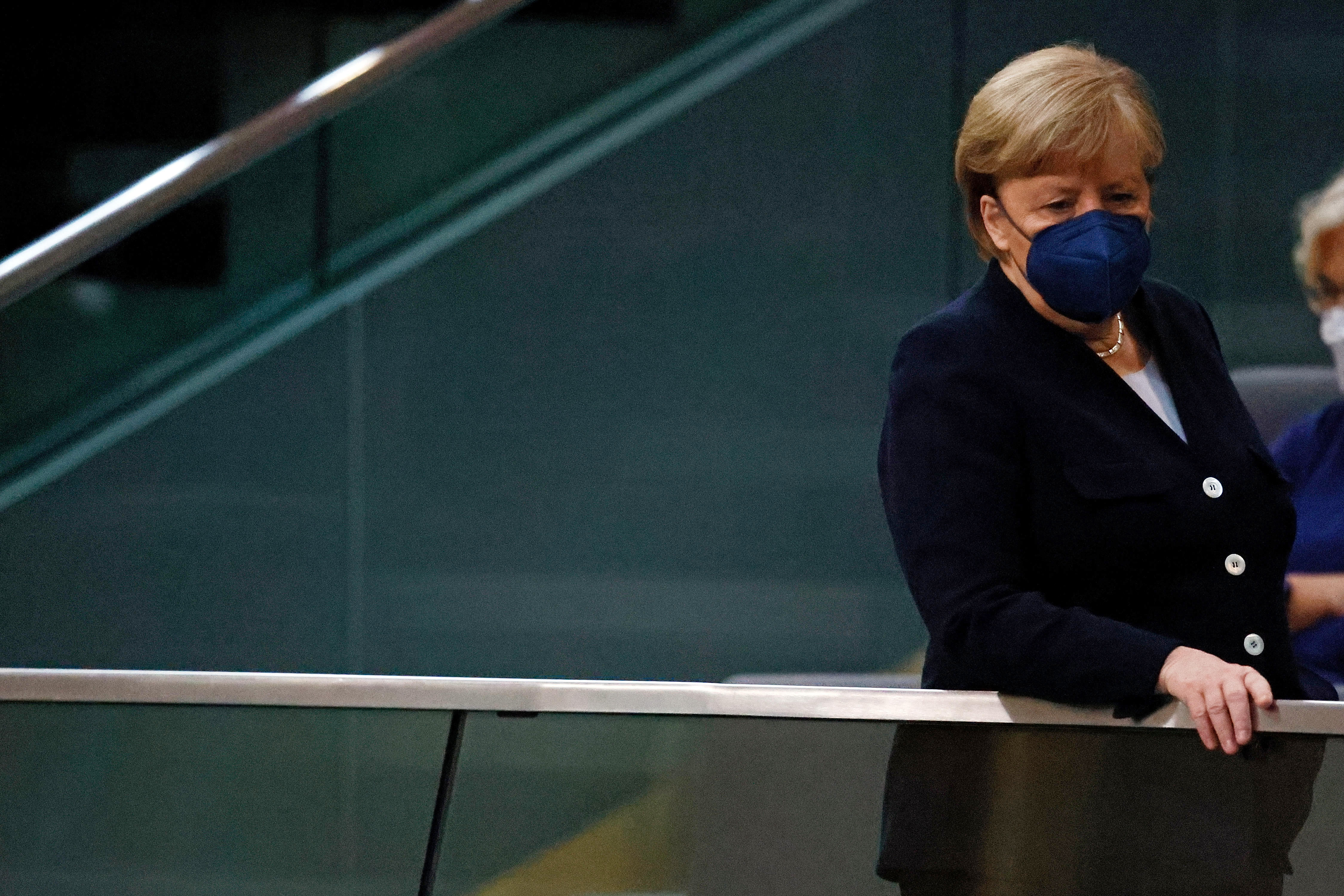 Outgoing Chancellor Angela Merkel arrives to watch a session at the Bundestag, Germany's parliament, to formally elect Olaf Scholz as the country's next Chancellor, on Dec. 8, 2021 in Berlin. 