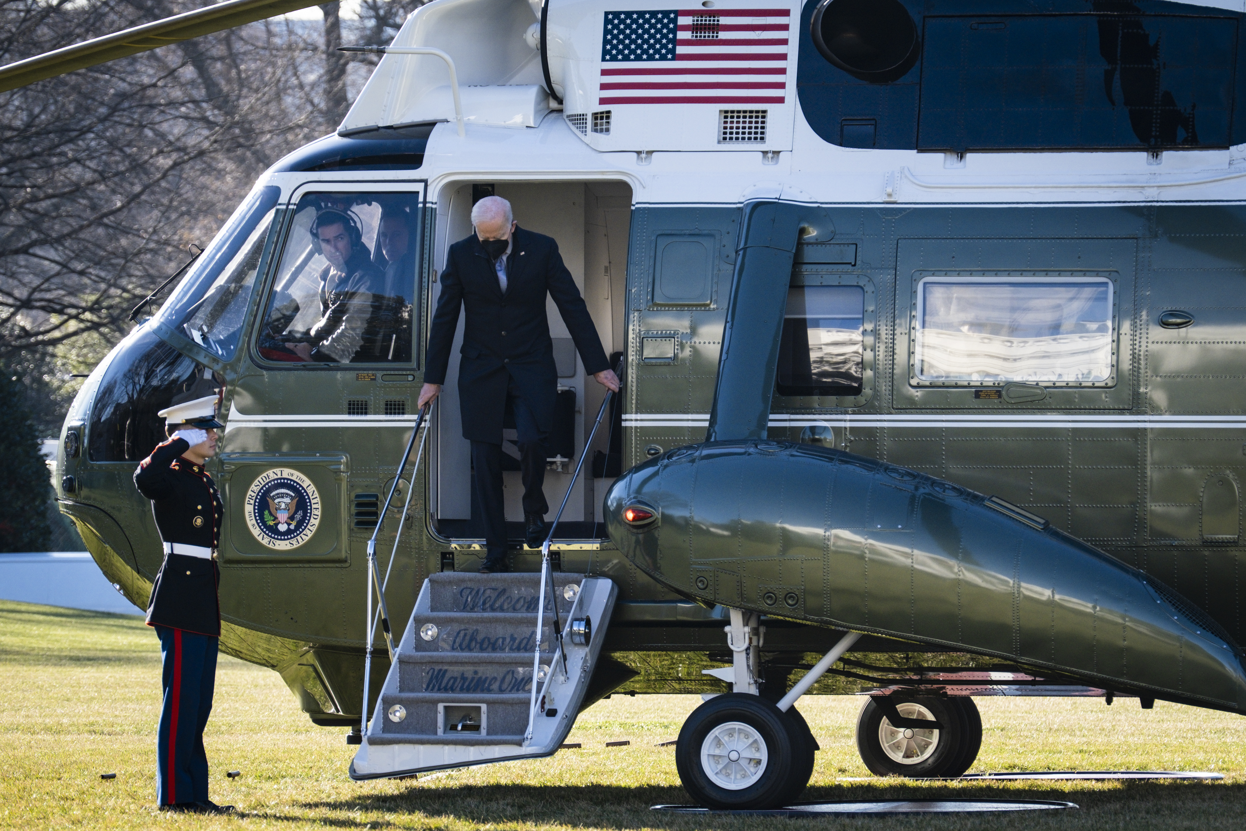 President Joe Biden disembarks from Marine One on the South Lawn of the White House in Washington, D.C., on Dec. 20, 2021.