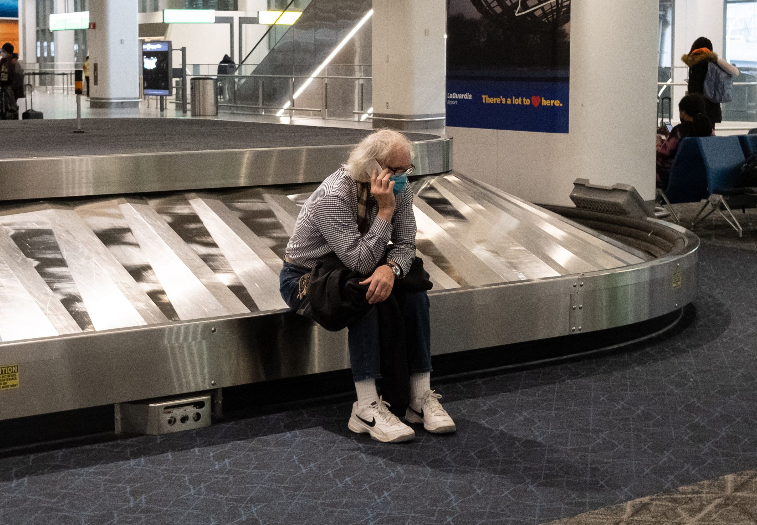 A person waiting for luggage in New York City.