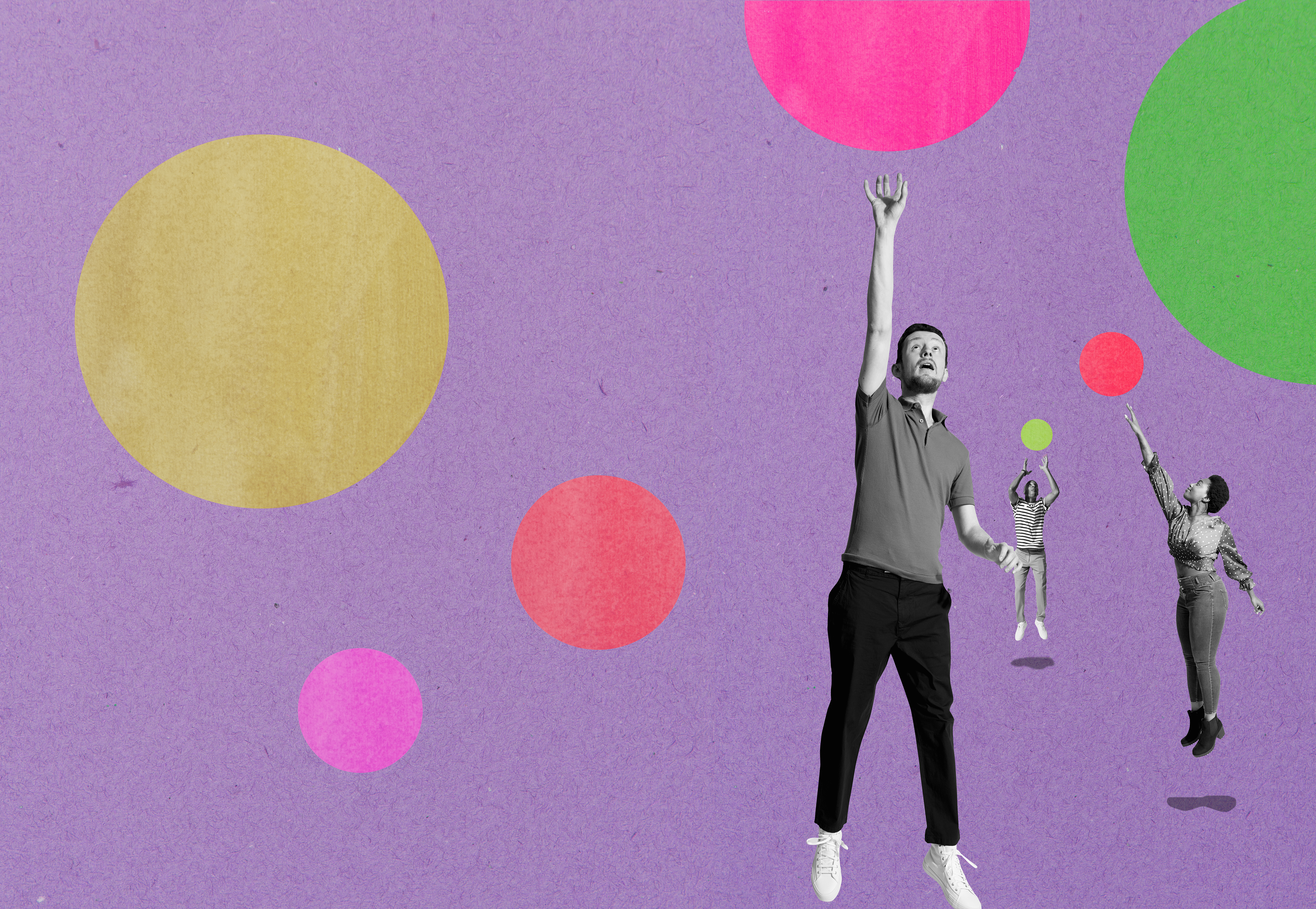 Three people leaping up to catch bubbles.