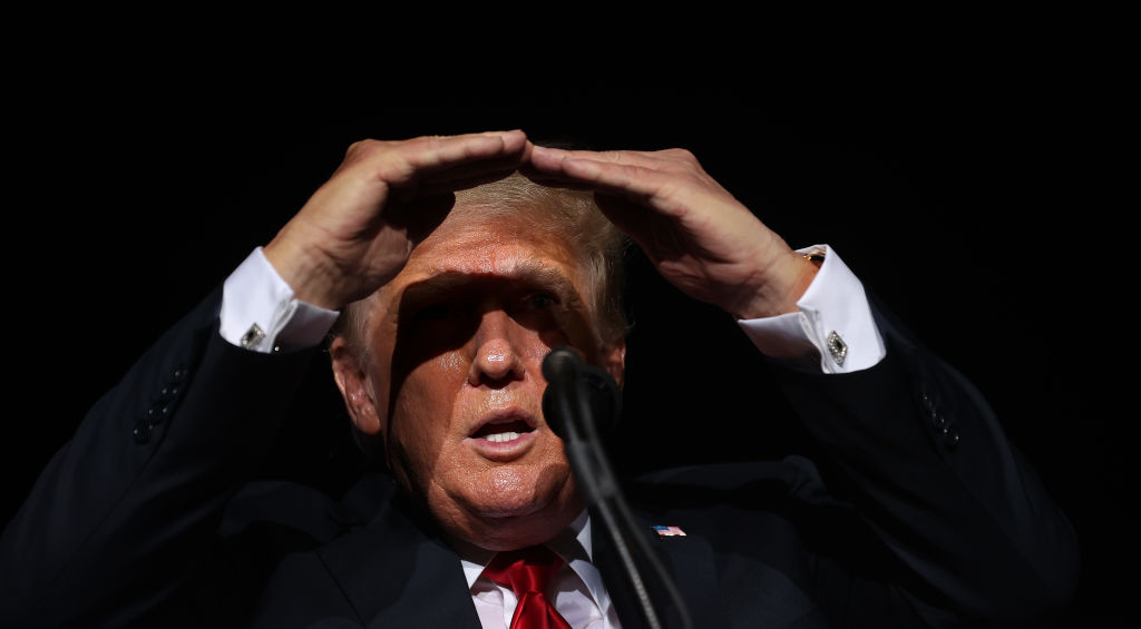 Former U.S. President Donald Trump addresses supporters during a rally at York Family Farms on August 21, 2021 in Cullman, Ala. According to the Alabama Department of Public Health, 67.5% of the state's population has not been fully vaccinated.