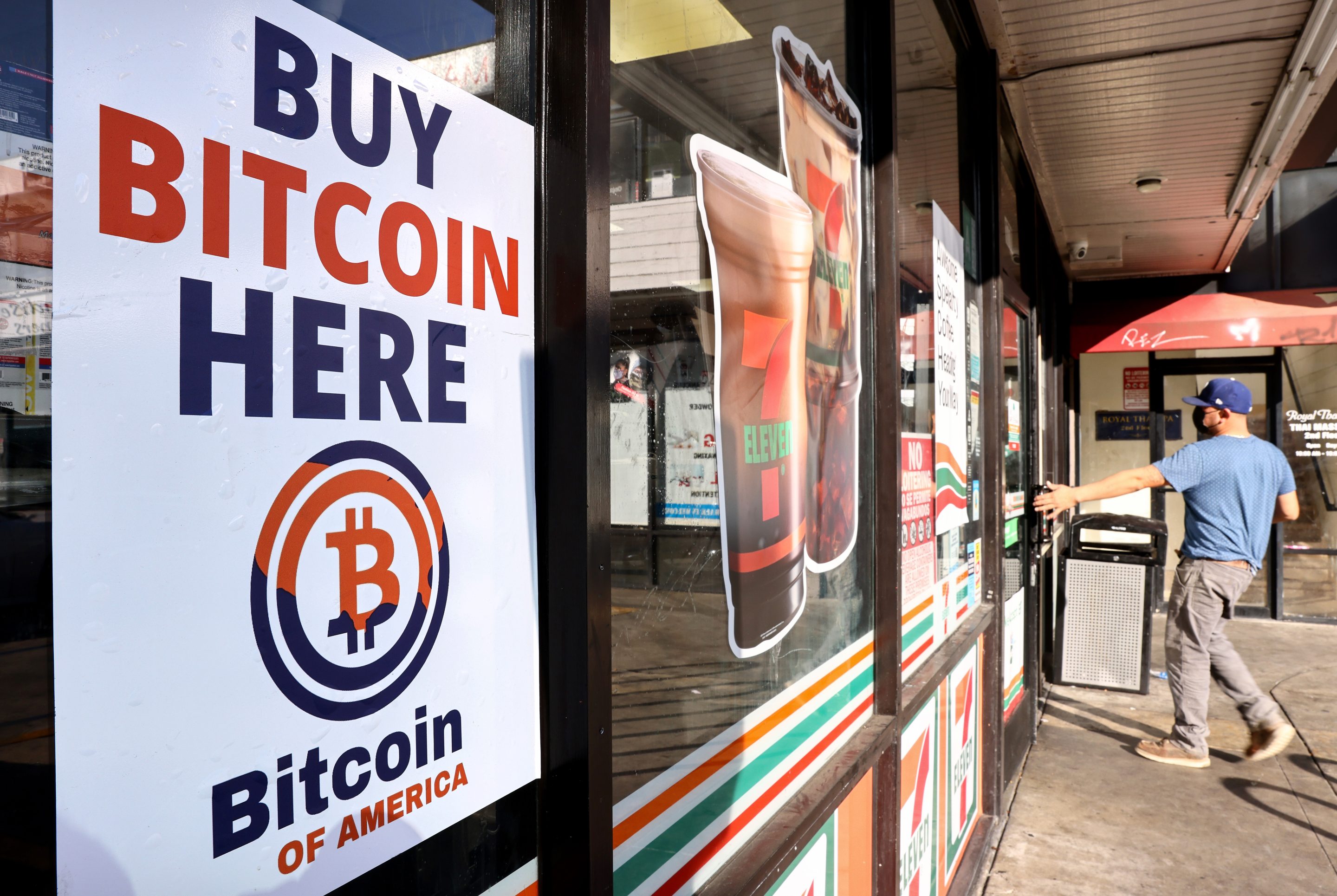 A 'Buy Bitcoin Here' sign is posted at a 7-Eleven store on November 10, 2021 in Los Angeles, California.