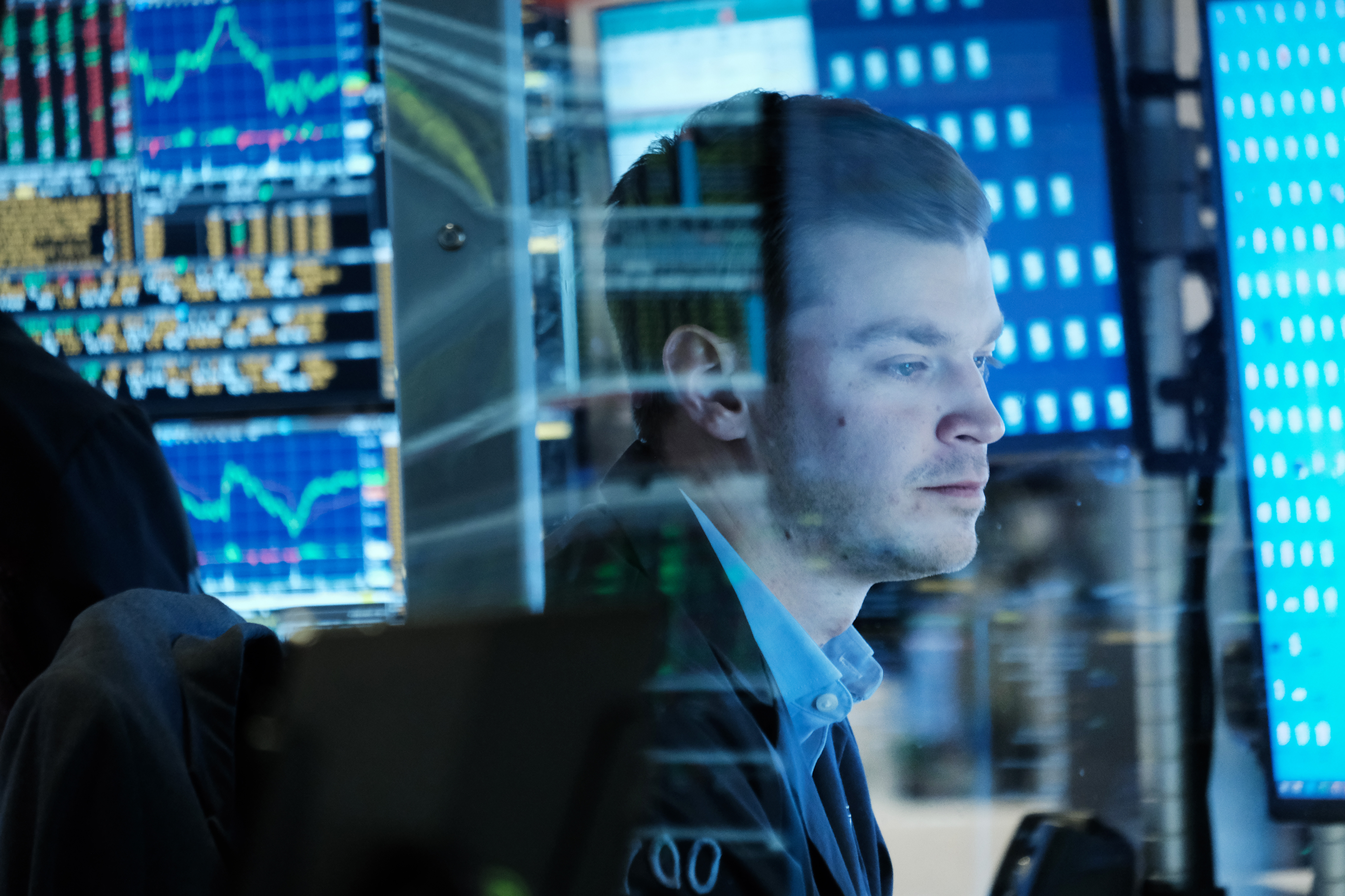 Traders work on the floor of the New York Stock Exchange. U.S. futures on Tuesday point to another strong day of gains, following Europe and Asia higher.