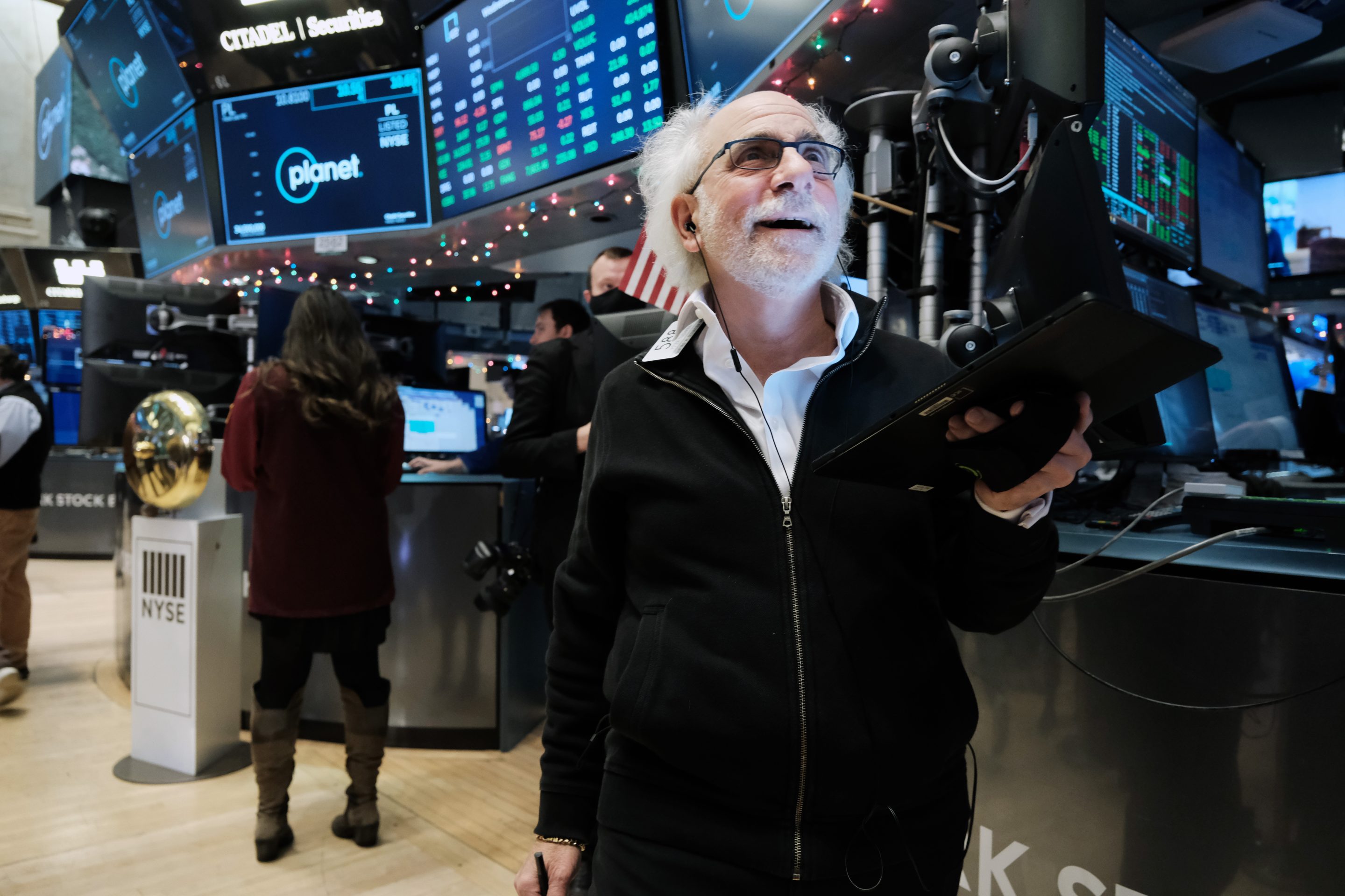 Traders work on the floor of the New York Stock Exchange on December 8.