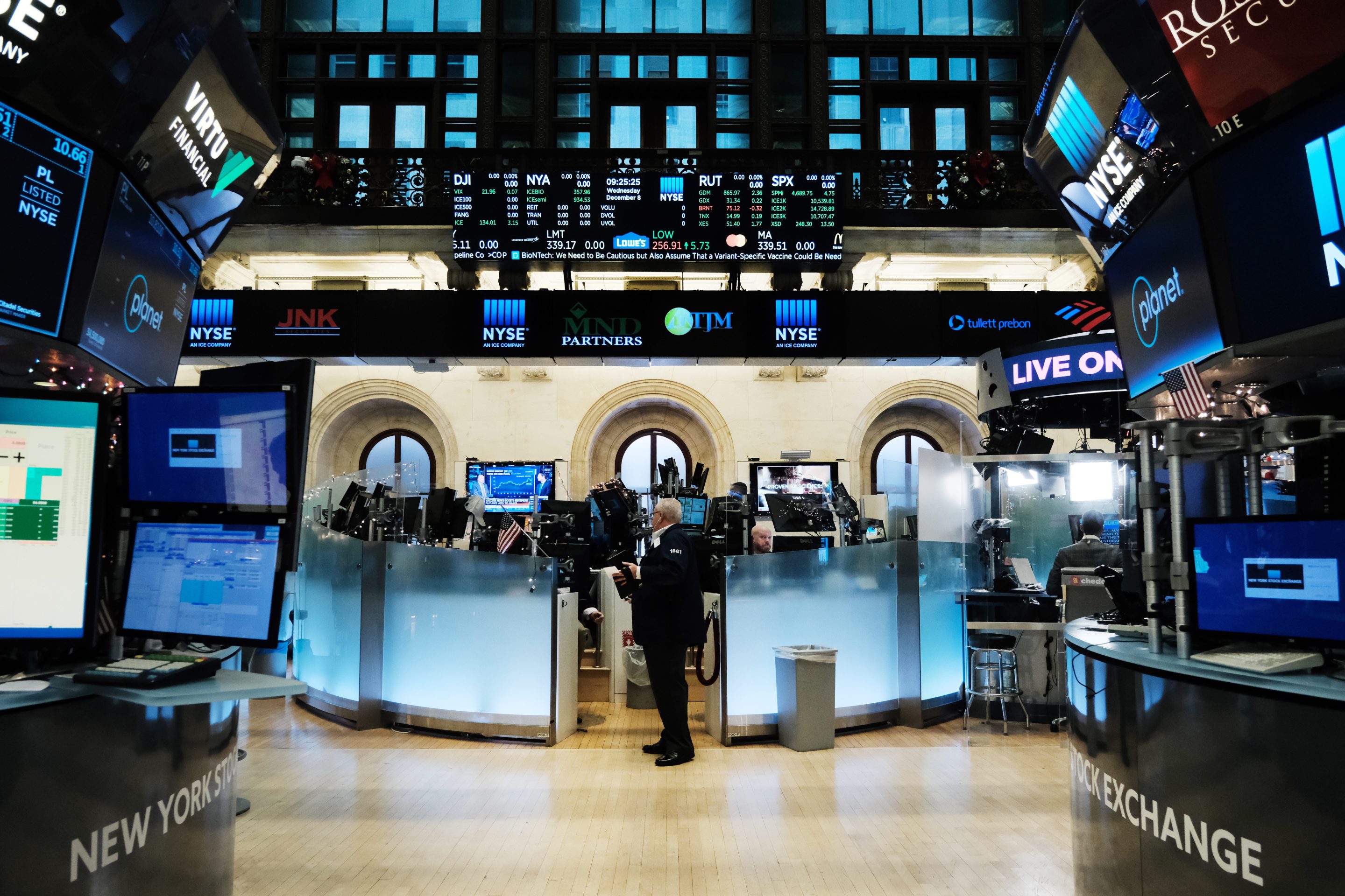 Traders work on the floor of the New York Stock Exchange on December 8.