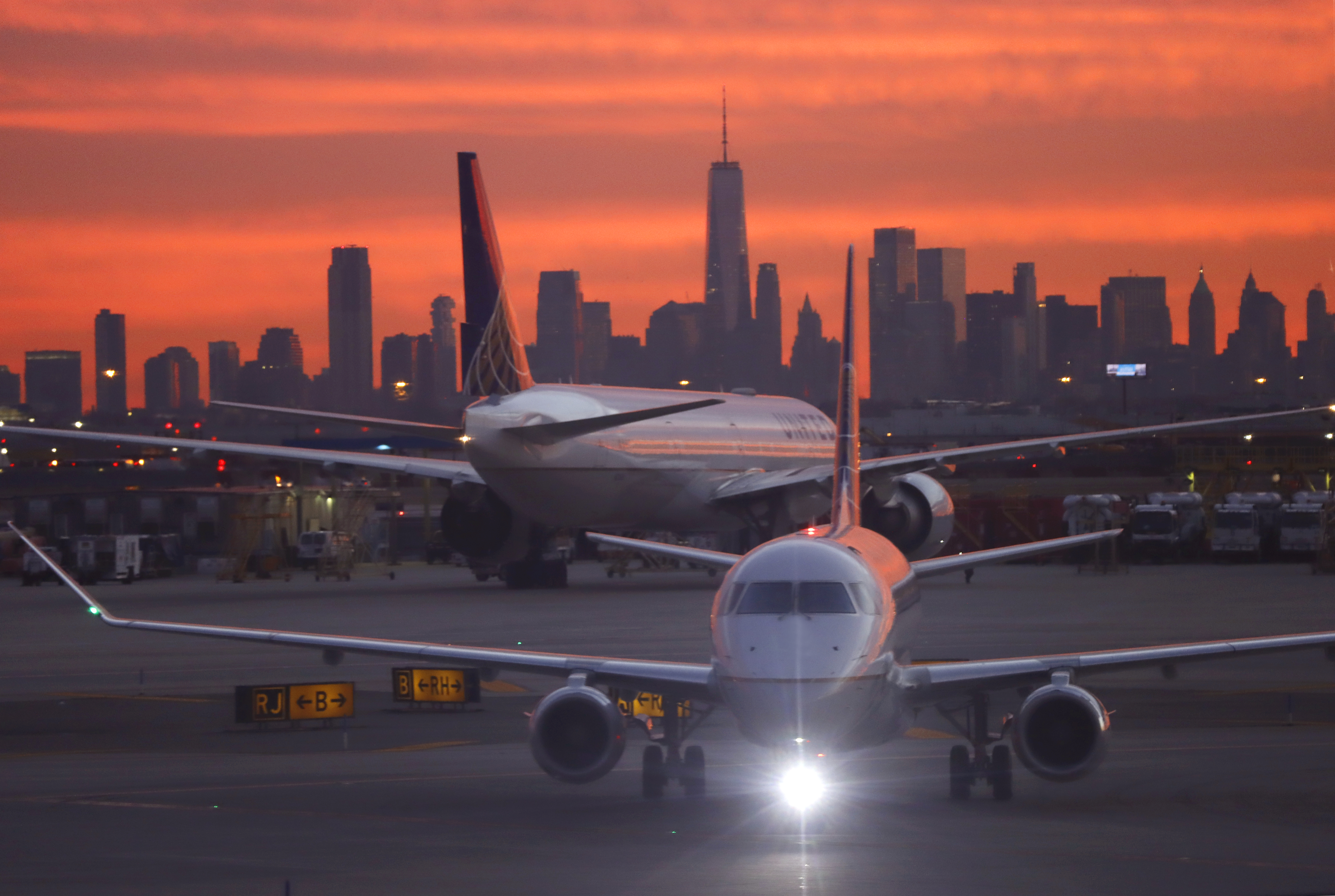 A United Airlines airplane  proceeds to a gate at Newark Liberty International Airport on Dec. 13, 2021.