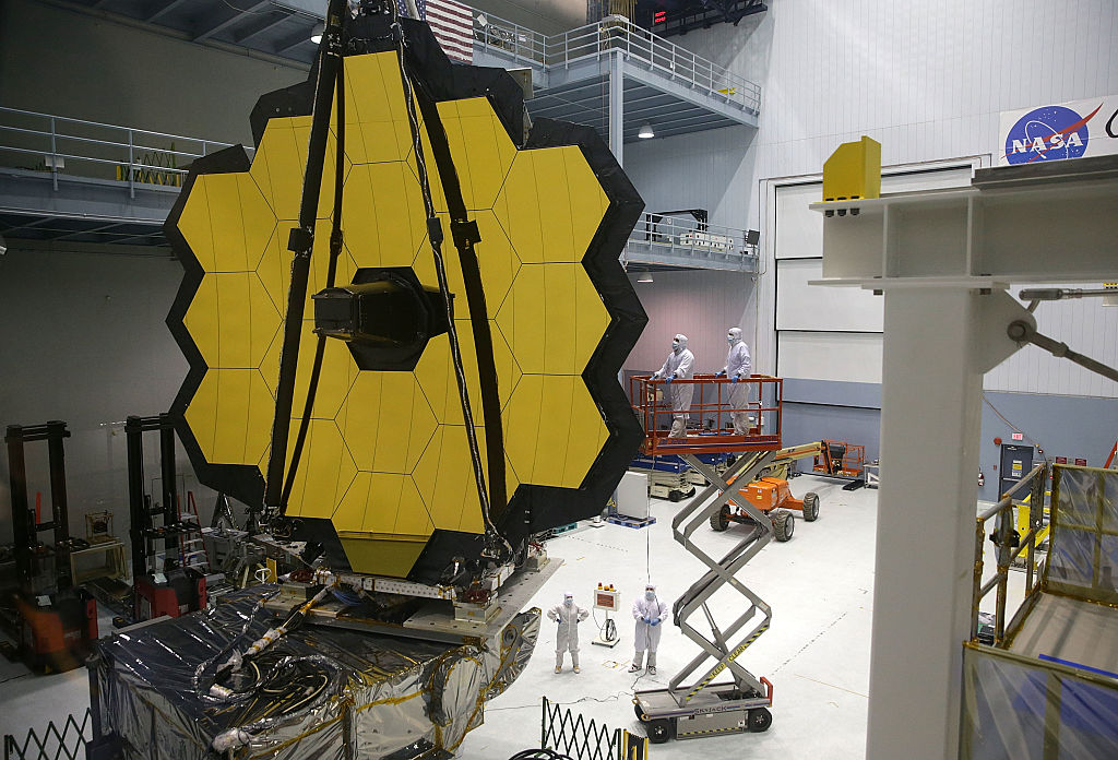Engineers and technicians assemble the James Webb Space Telescope November 2, 2016 at NASA's Goddard Space Flight Center in Greenbelt, Md. The telescope, designed to be a large space-based observatory optimized for infrared wavelengths, will be the successor to the Hubble Space Telescope and the Spitzer Space Telescope.