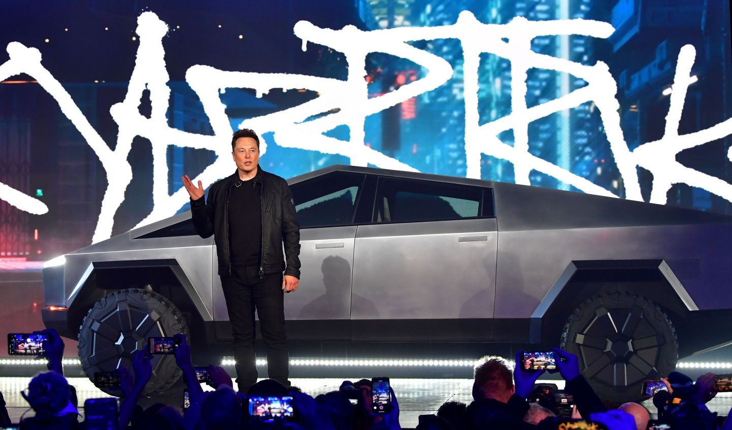 Tesla cofounder and CEO Elon Musk with a Cybertruck