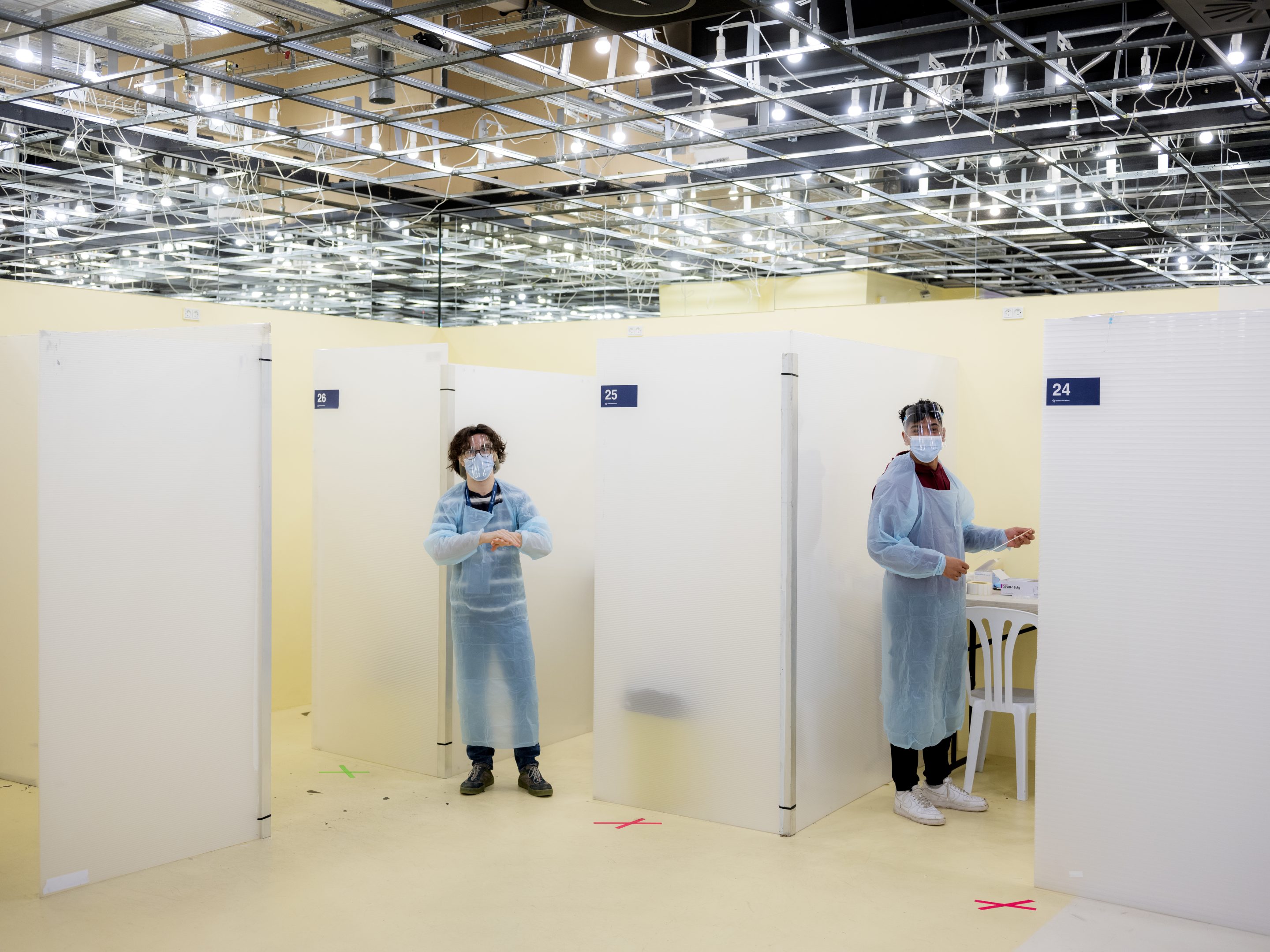 Workers wait for people at a Covid-19 quick testing center at Fisketorvet shopping mall in Copenhagen, Denmark.