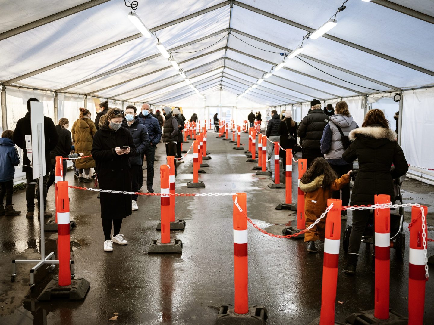 People wait in line for a COVID-19 test outside Copenhagen.