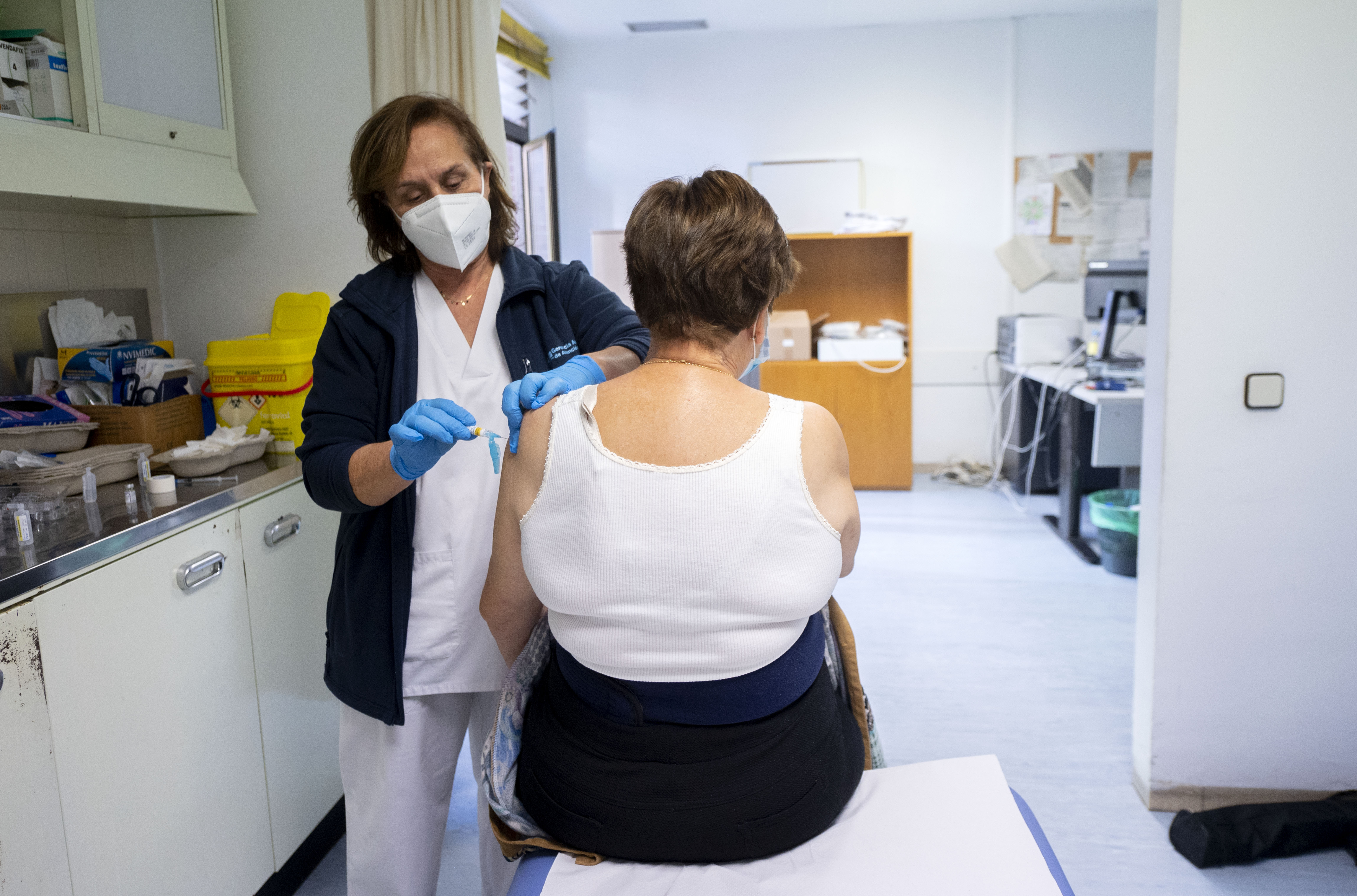 A woman receives the flu vaccine on the day the second phase of the vaccination campaign begins, at the Pozuelo de Alarcon Health Center, on Nov. 8, 2021, in Pozuelo de Alarcon, Madrid, Spain.