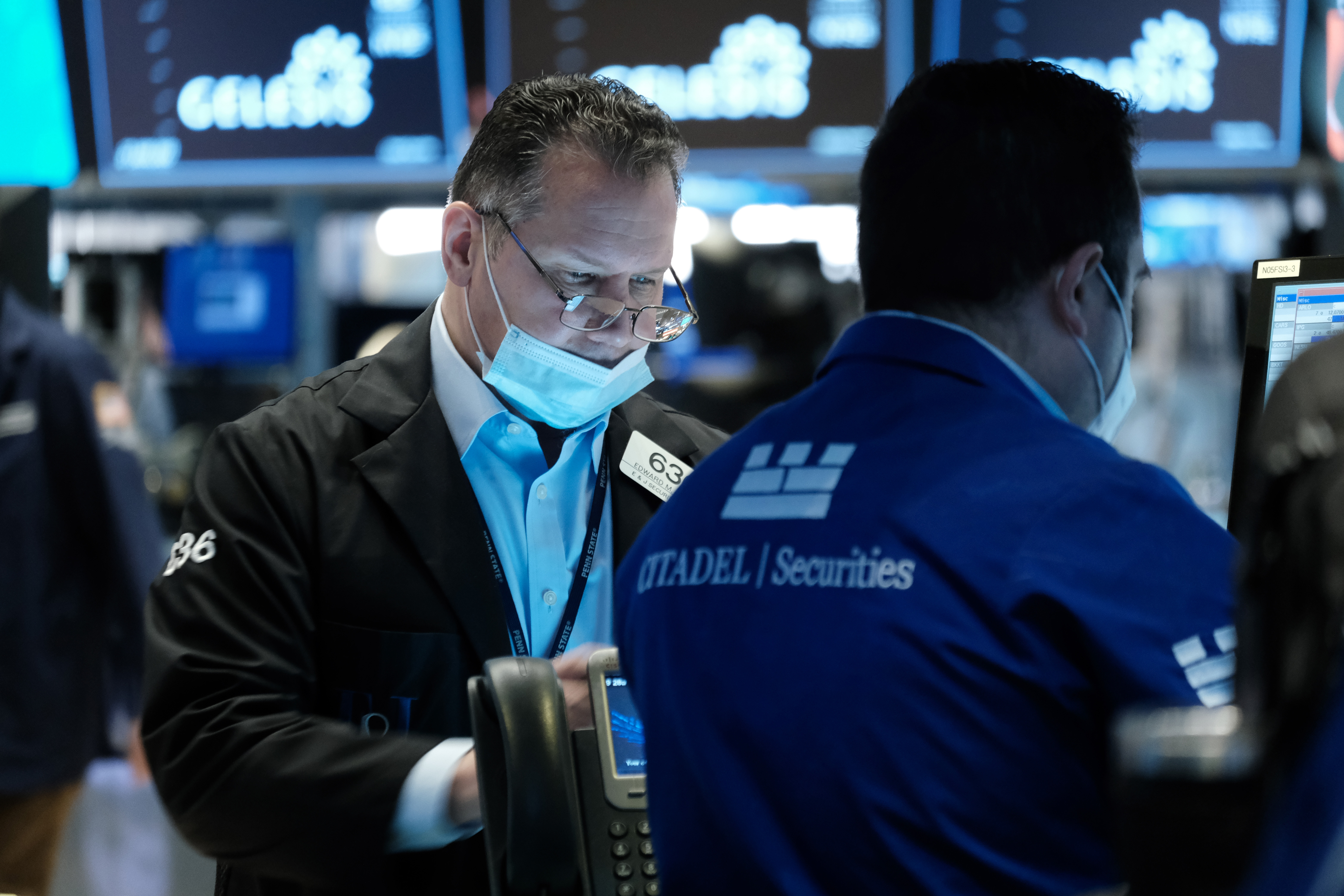 Traders work on the floor of the New York Stock Exchange. After Monday's stunning late-day rally, U.S. equities look set to open solidly in the red on Tuesday.