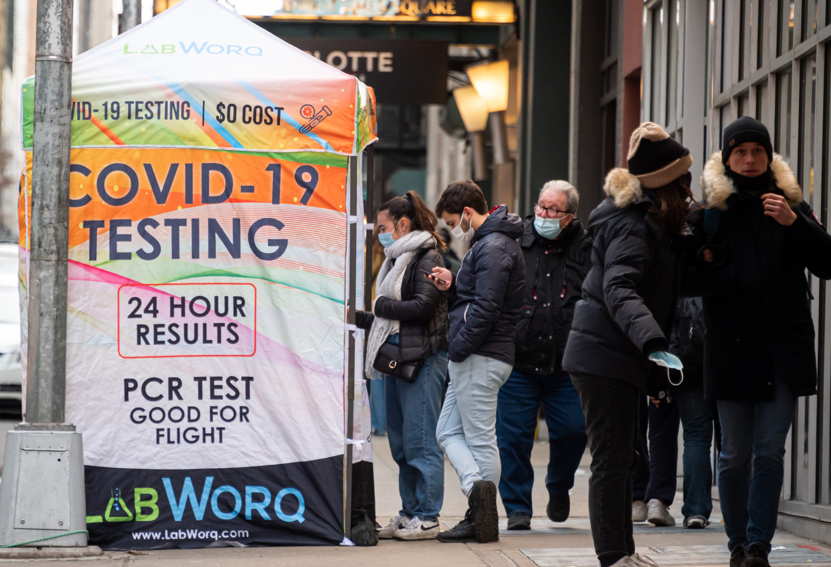 People line up for a COVID-19 PCR test in Times Square on Jan. 25, 2022, in New York City.