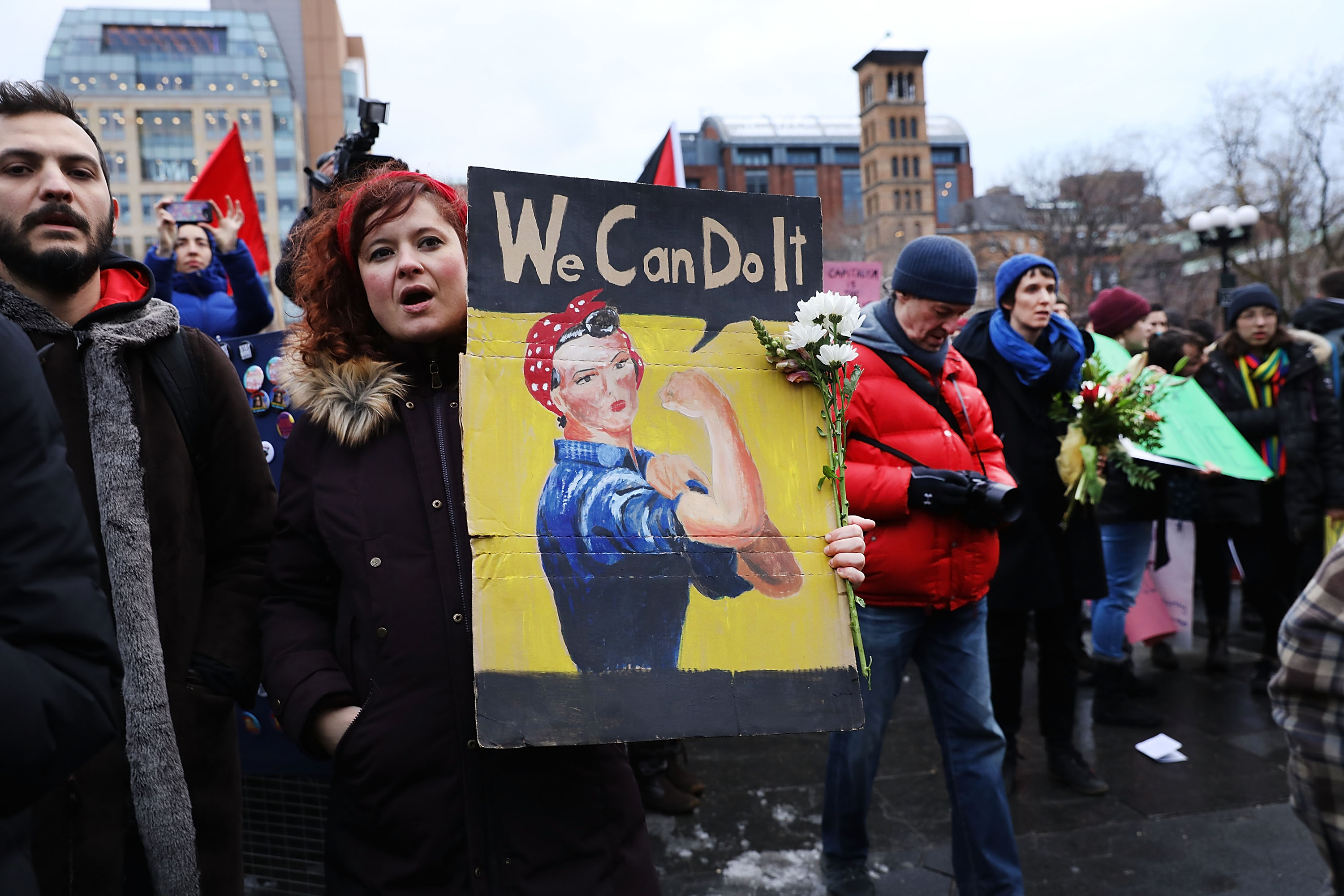 Dozens of women and men attend a rally and march in Washington Square Park for international Women's Day on March 8, 2018 in New York City.