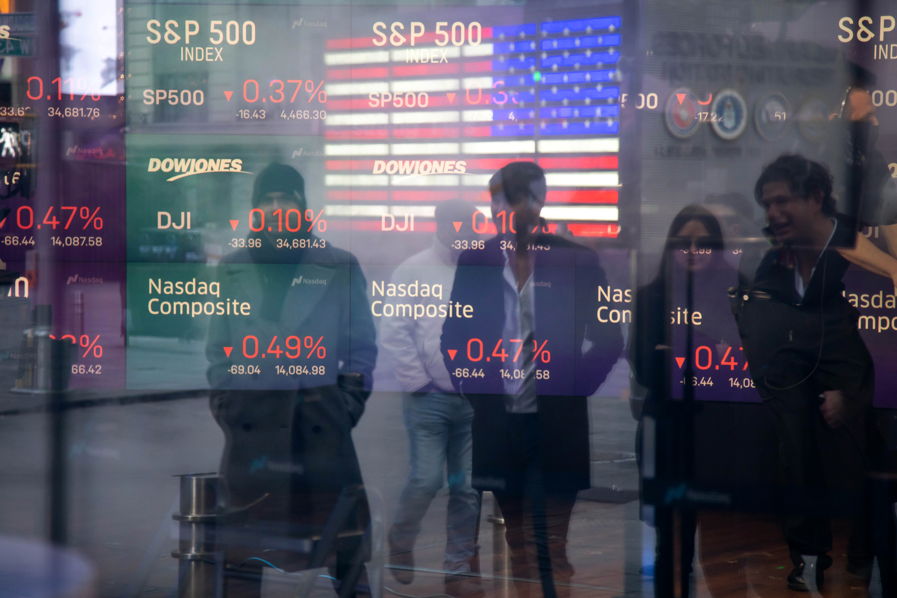 Monitors display stock market information at the Nasdaq MarketSite in New York.